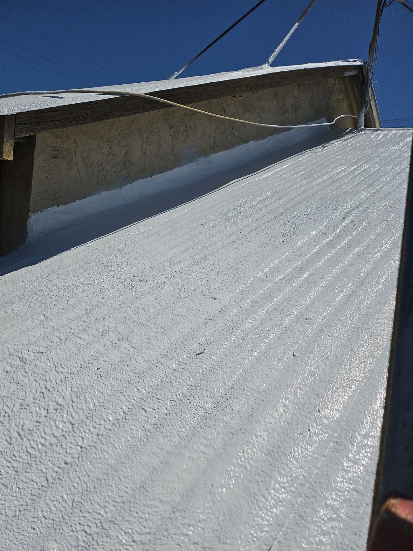 Spray foam and coatings using Conklin Benchmark/PUMA XL by Straight Edge Roofing Inc