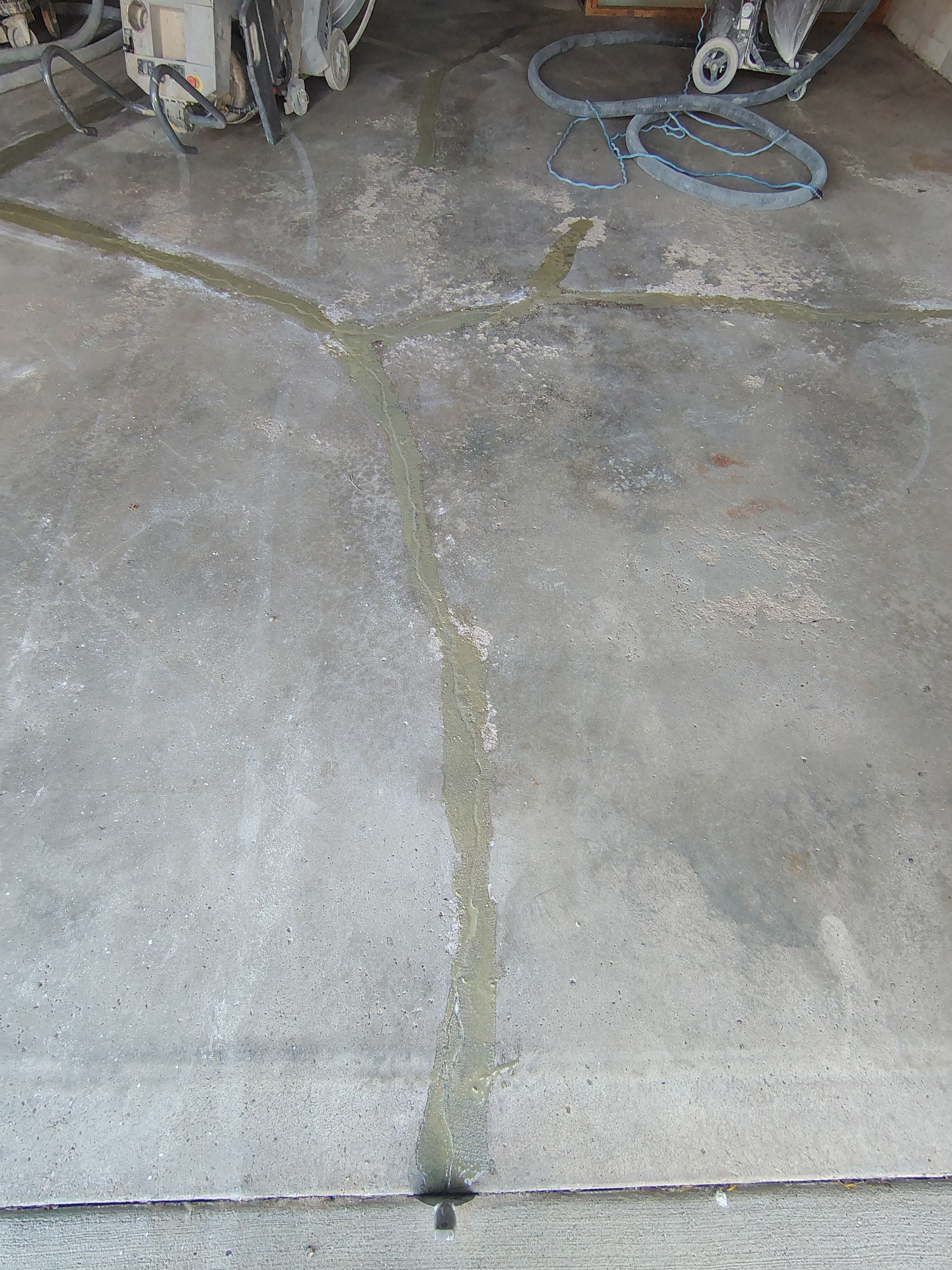 Sioux Falls Garage Epoxy Floor Installation and Concrete Crack Repair by Select Painting, Coatings & Garage Cabinets