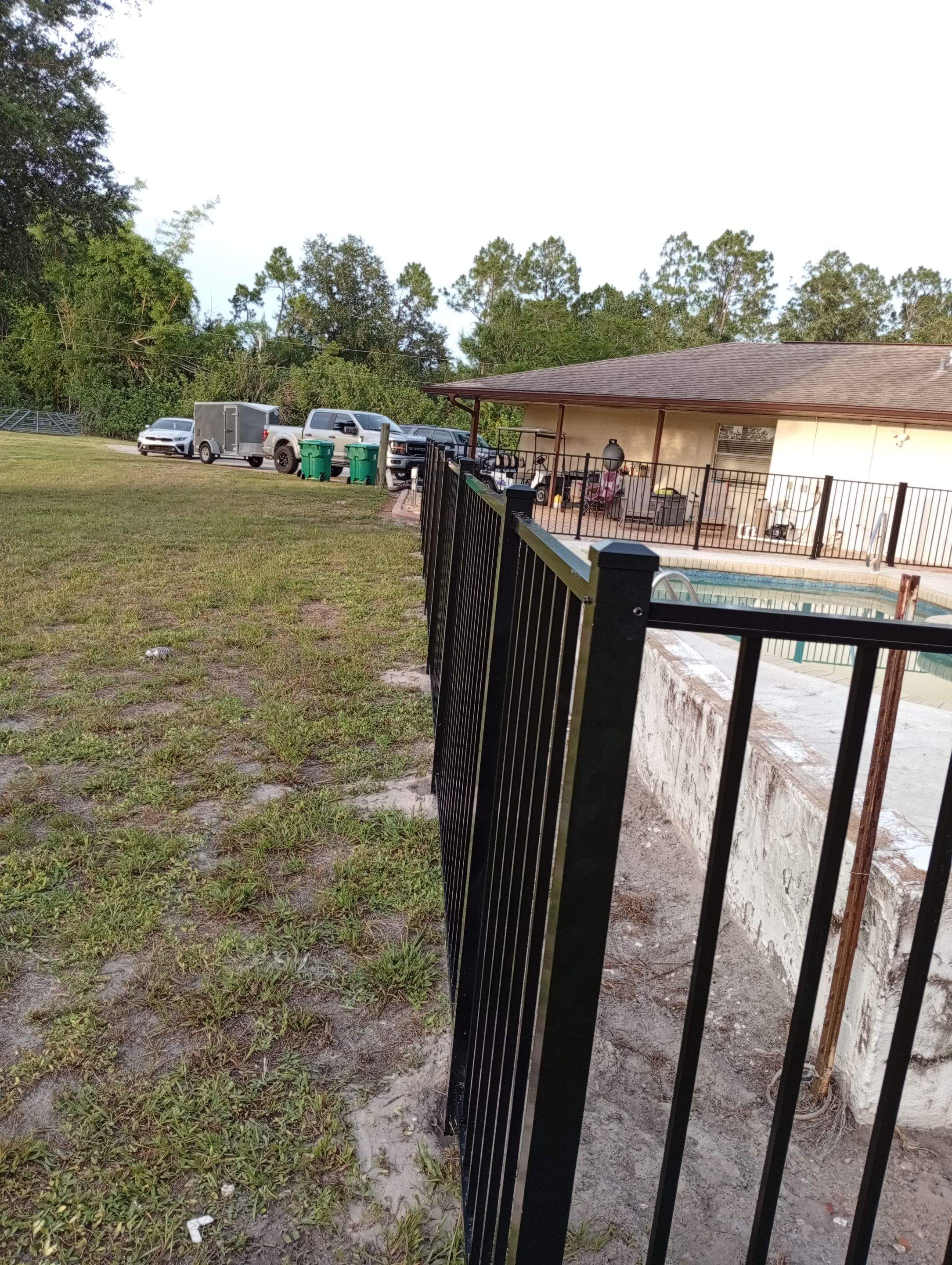 Black Aluminum Pool Safety Fence Installation in Punta Gorda by True Fence LLC