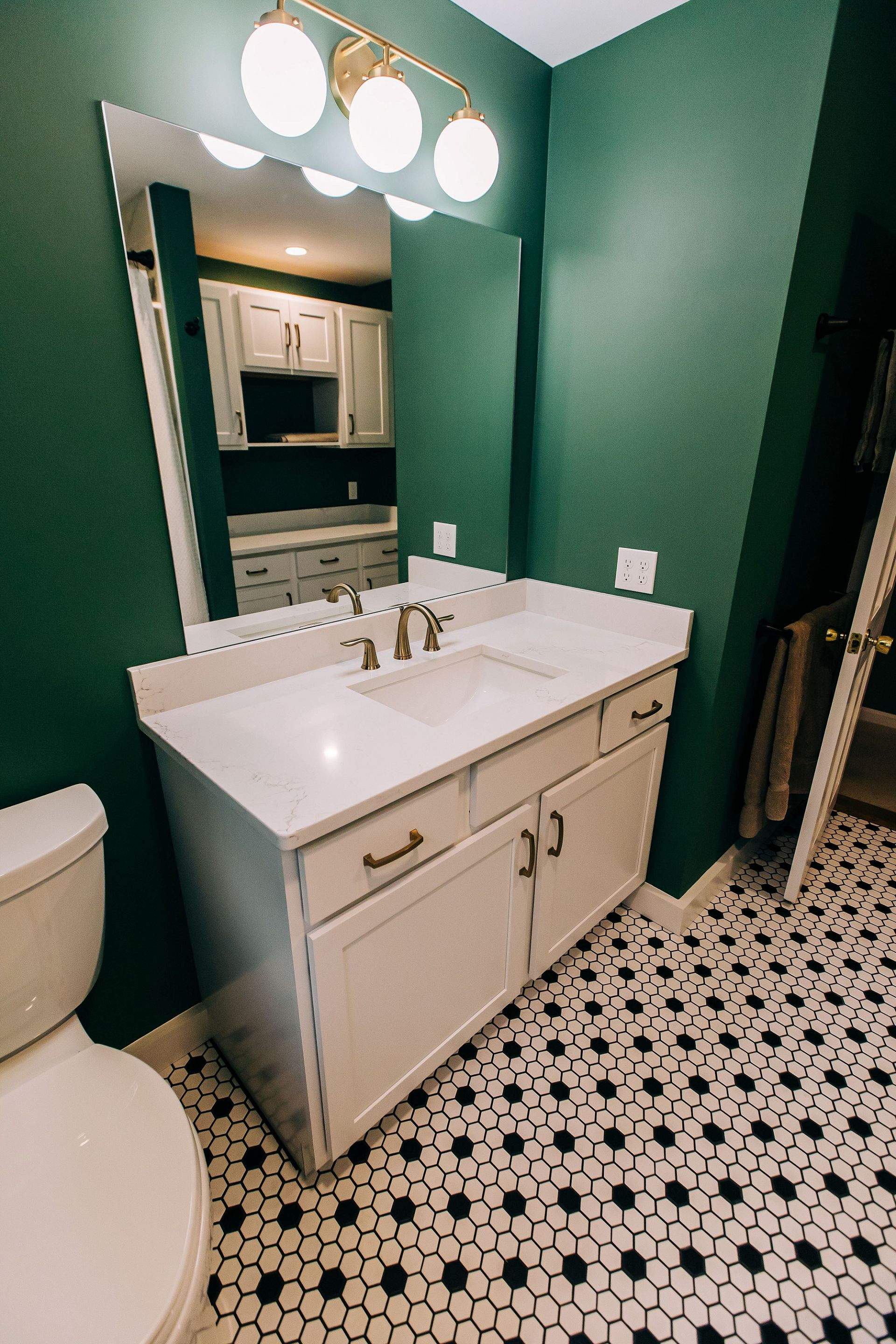 Green & Gold Bathroom by Renovatic LLC