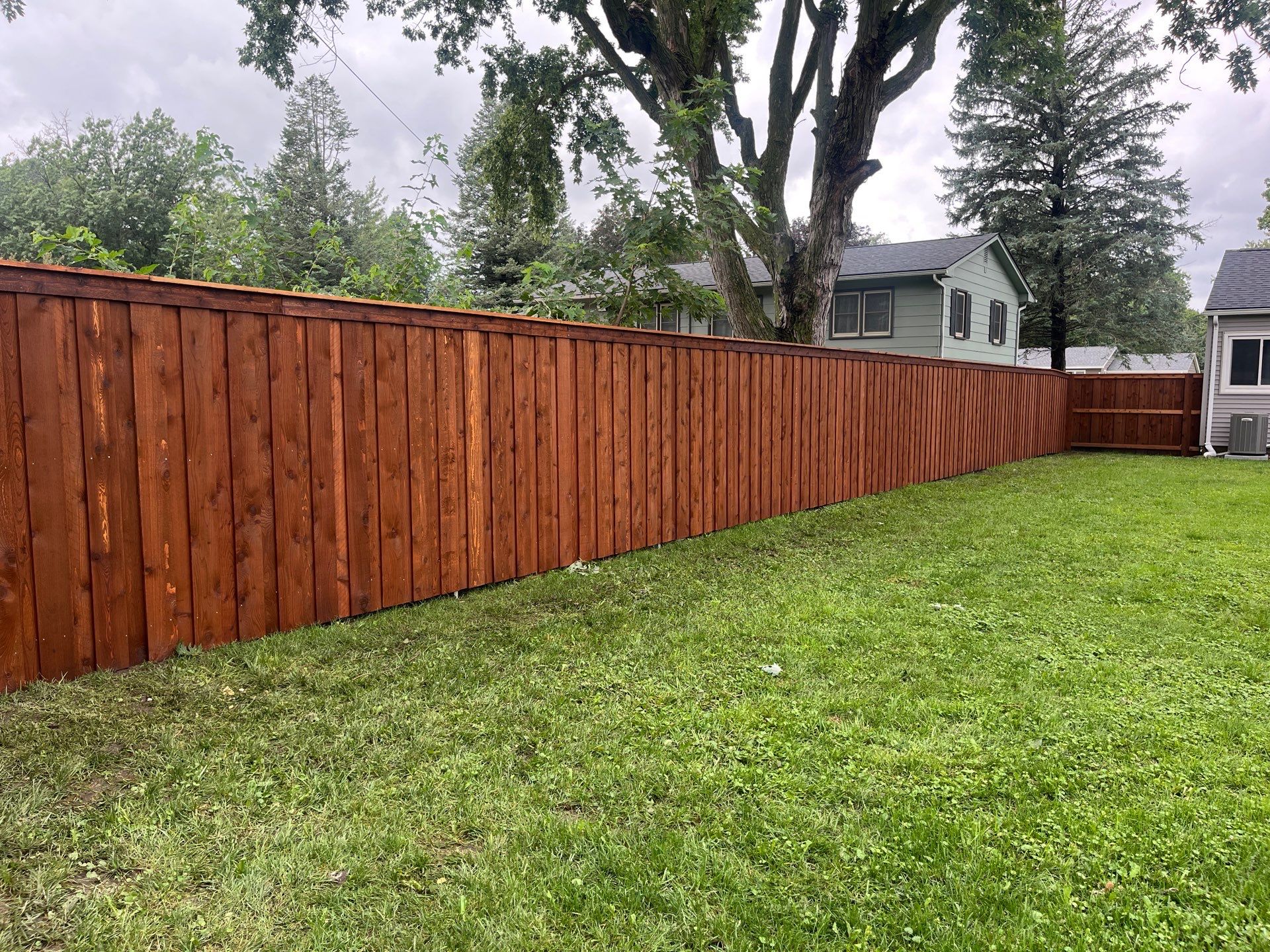 Board on Board Wood Privacy Fence Installation in Cedar Falls by Perfect Picket Fence and Stain