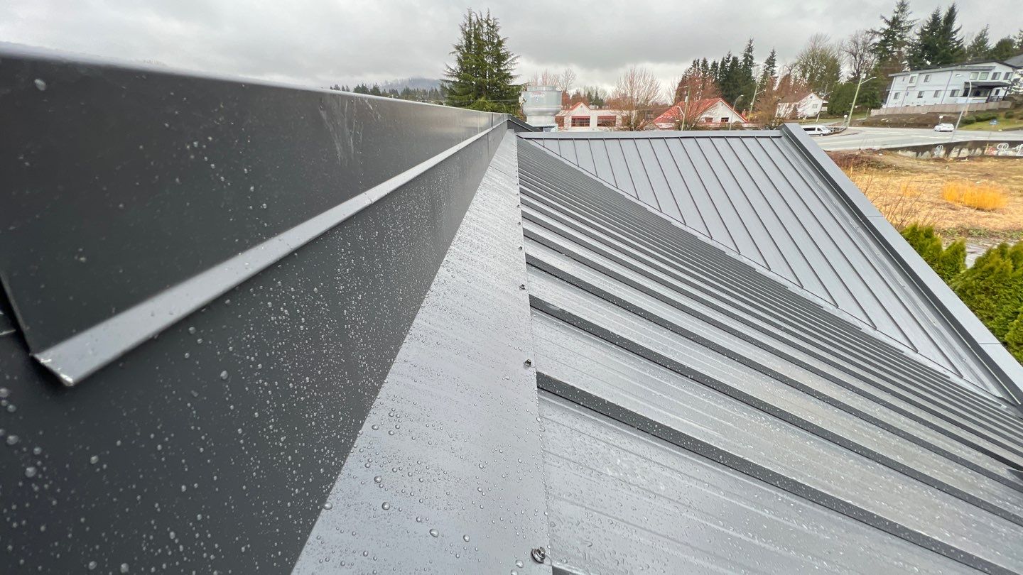 Commercial Roofing Installation using 12" Prolok metal and hidden gutters! by Top Notch Roofing Inc