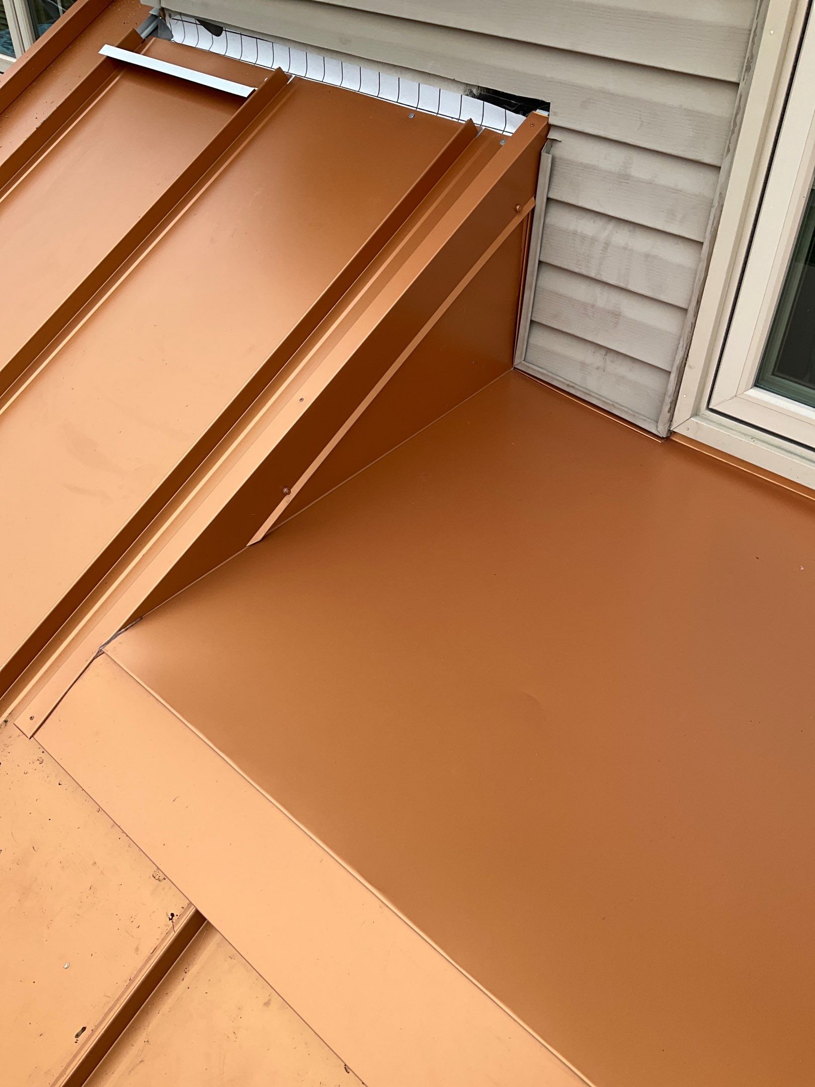 Standing Seam Roof – Copper Finish by Esh Builders