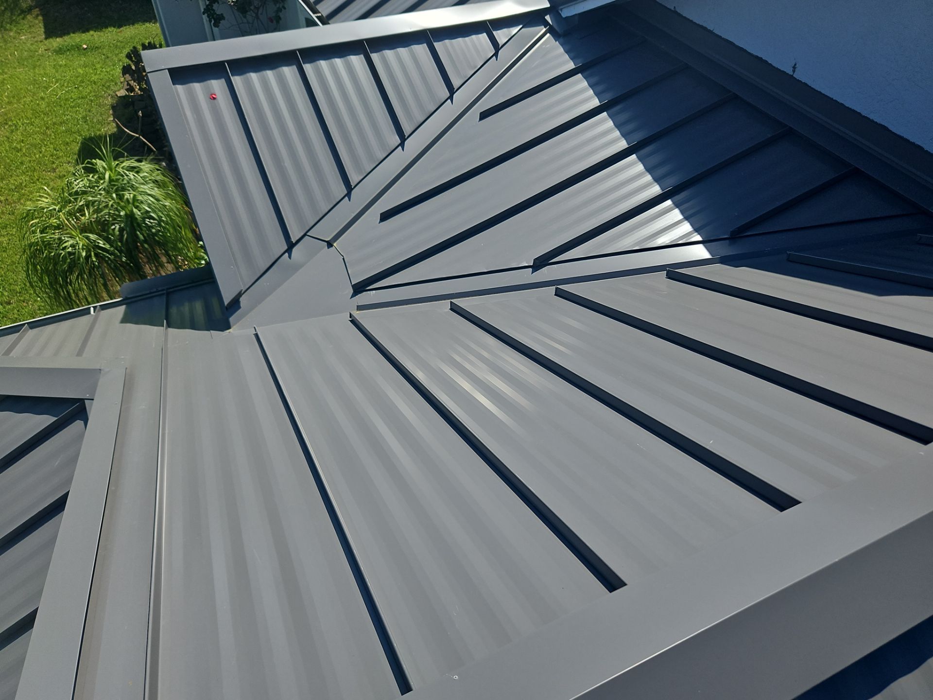 Complete Metal Roof Replacement and Seamless Gutter Installation in Melbourne by Wiedmann Construction & Roofing