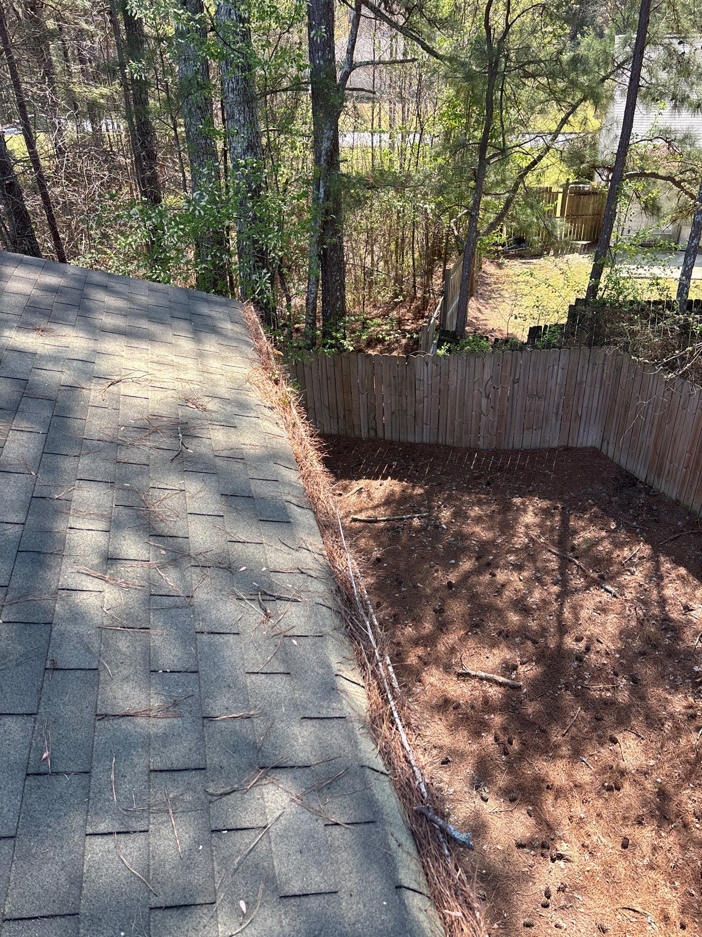 HOA gutter cleaning in Pinehurst & Southern Pines, NC,before  photo showing full gutters.