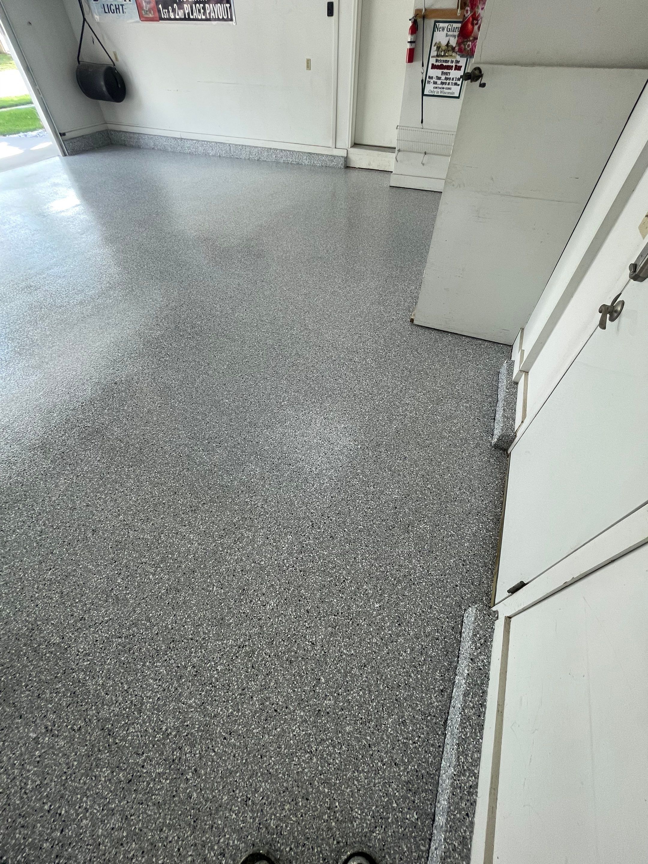 Residential Garage Floor Coating with Feather Grey Finish in Sioux Falls by Select Painting, Coatings & Garage Cabinets