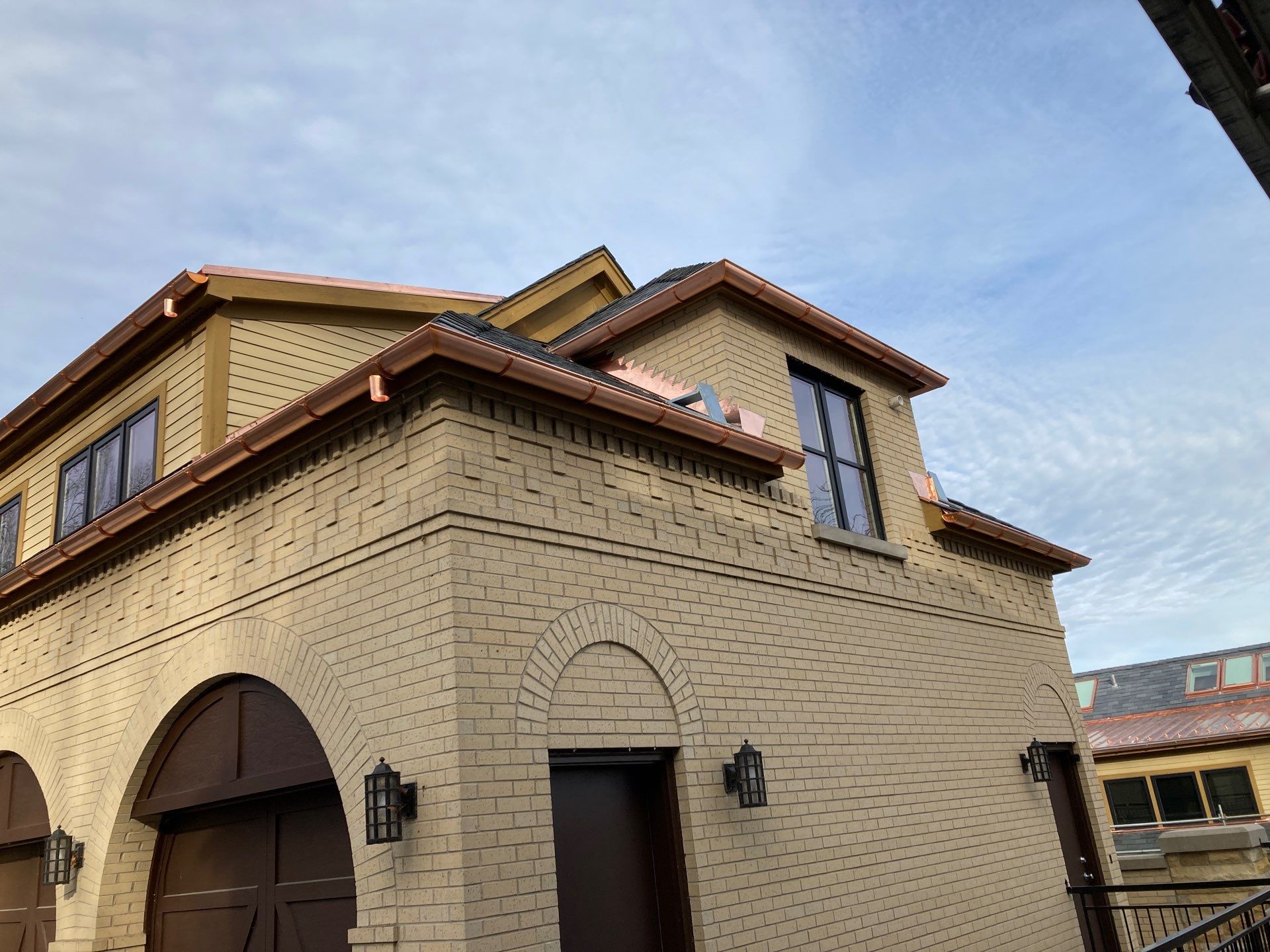 Slate Roof Replacement and Half Round Copper Gutter Installation by Custom Installations