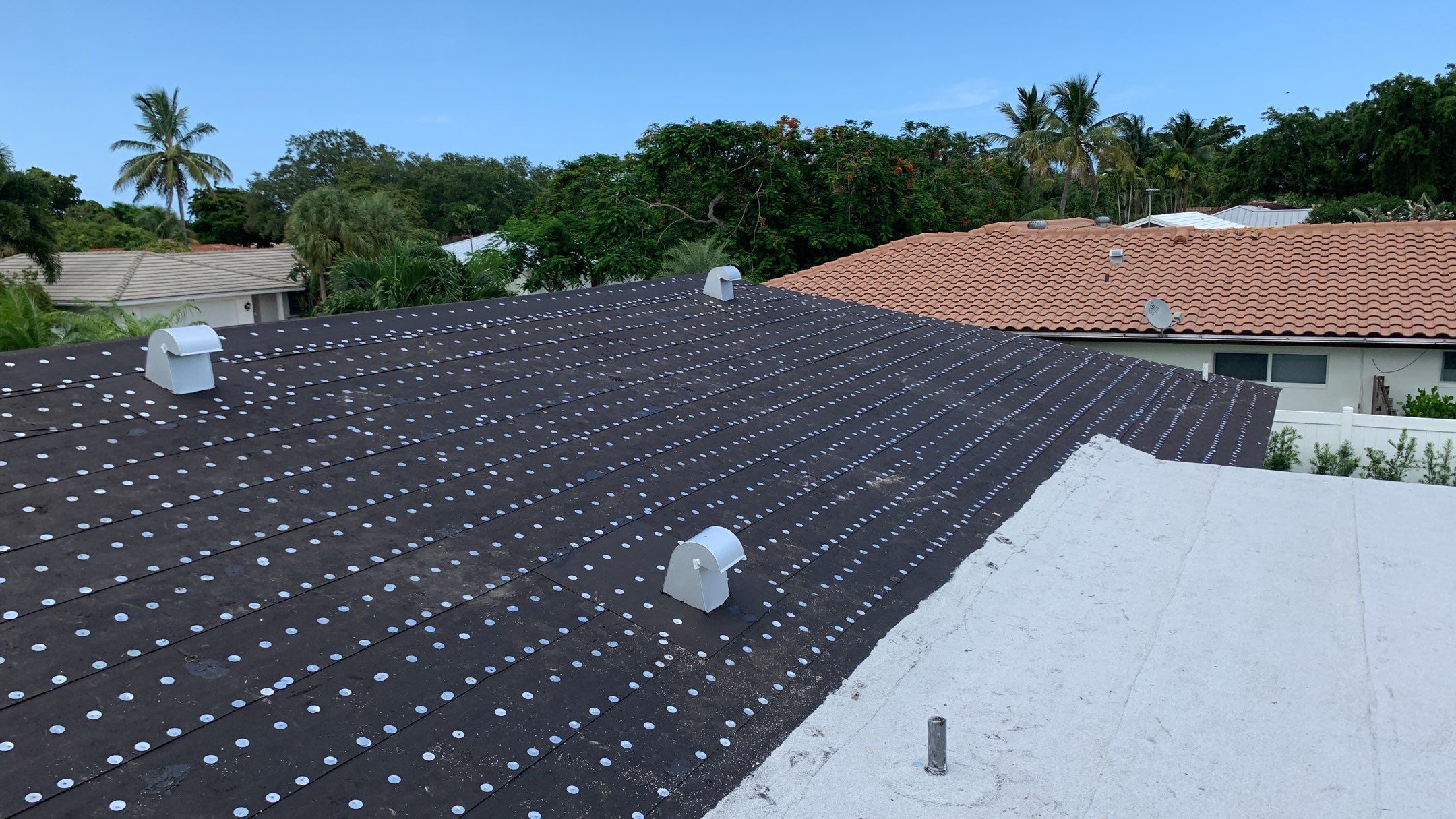 Residential Roofing Installation using 1" Nail strip metal roof by BLUES BROTHERS CONSTRUCTION CORP