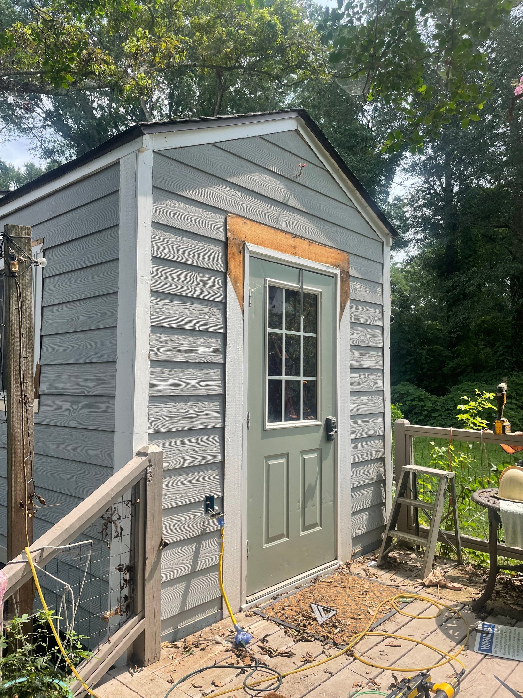 tiny home remodel- siding,paint,roofing by Nailed It Roofing & Remodeling LLC