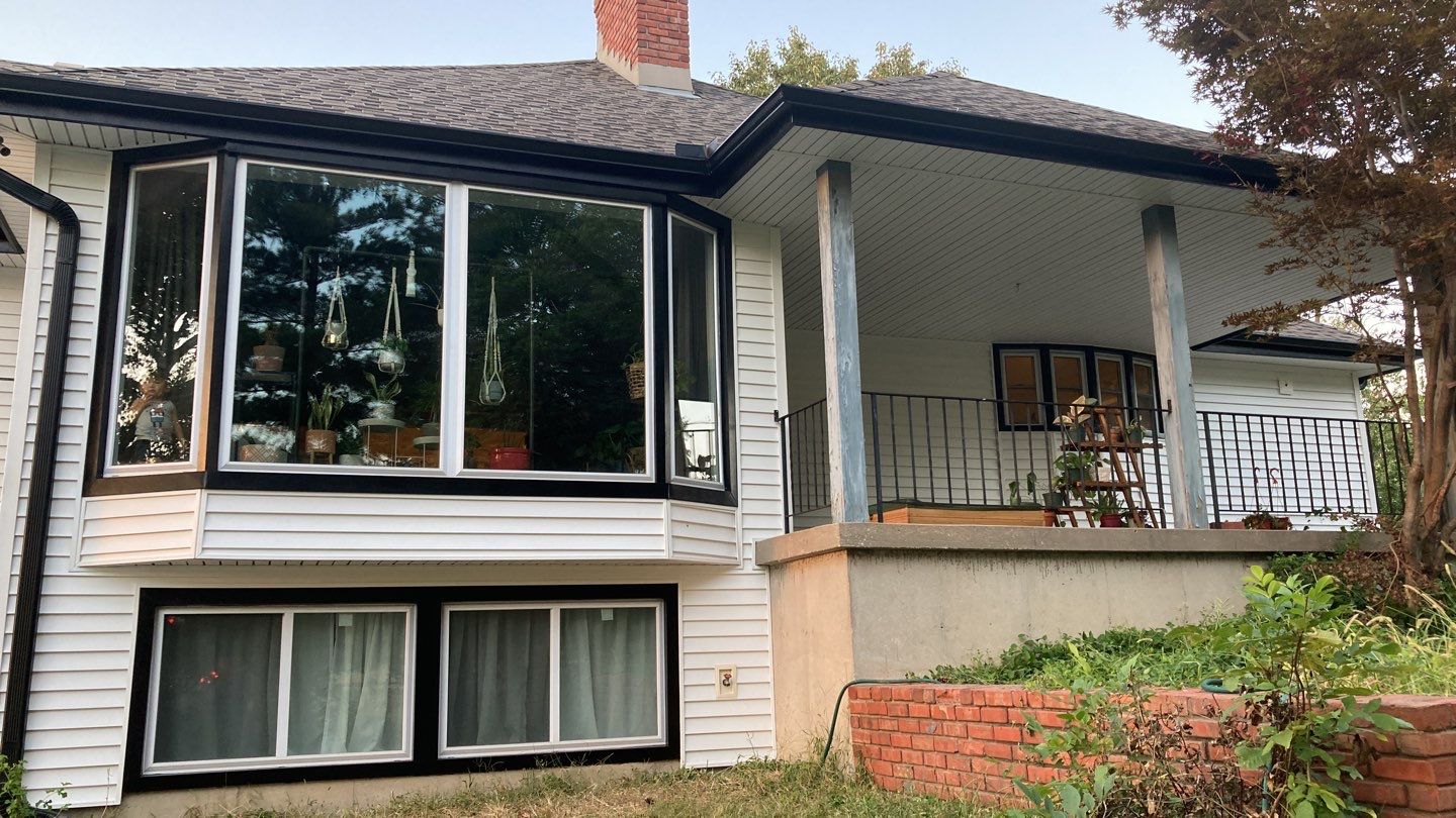 New white siding with Black trim by EEC  Windows, Siding & Roofing 