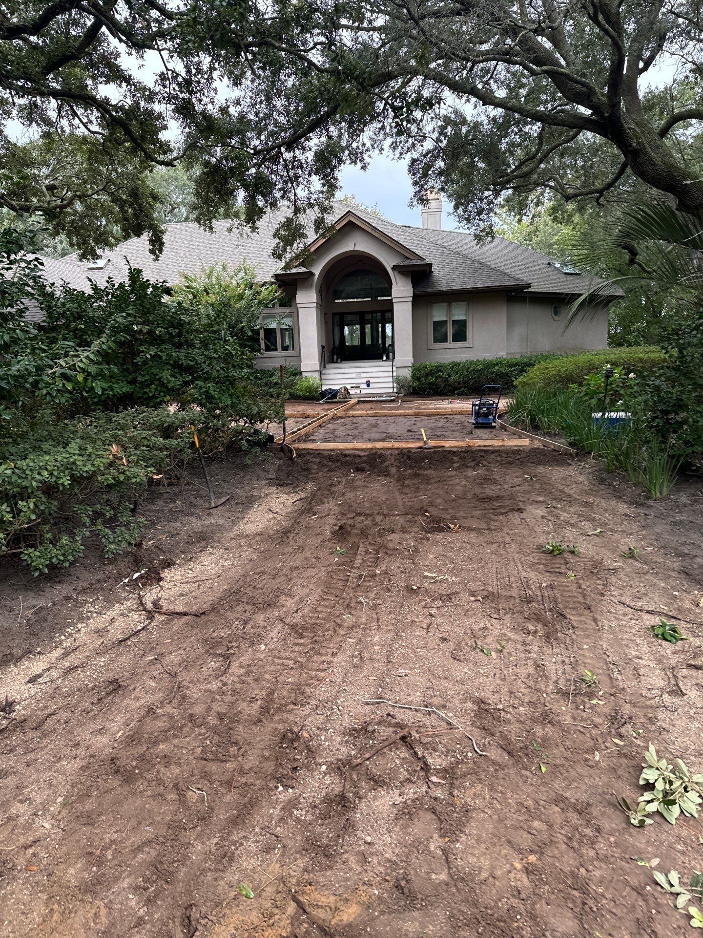 Custom Concrete Driveway with Decorative Paver Inlays in Hilton Head Island by Lowcountry Scapes, LLC