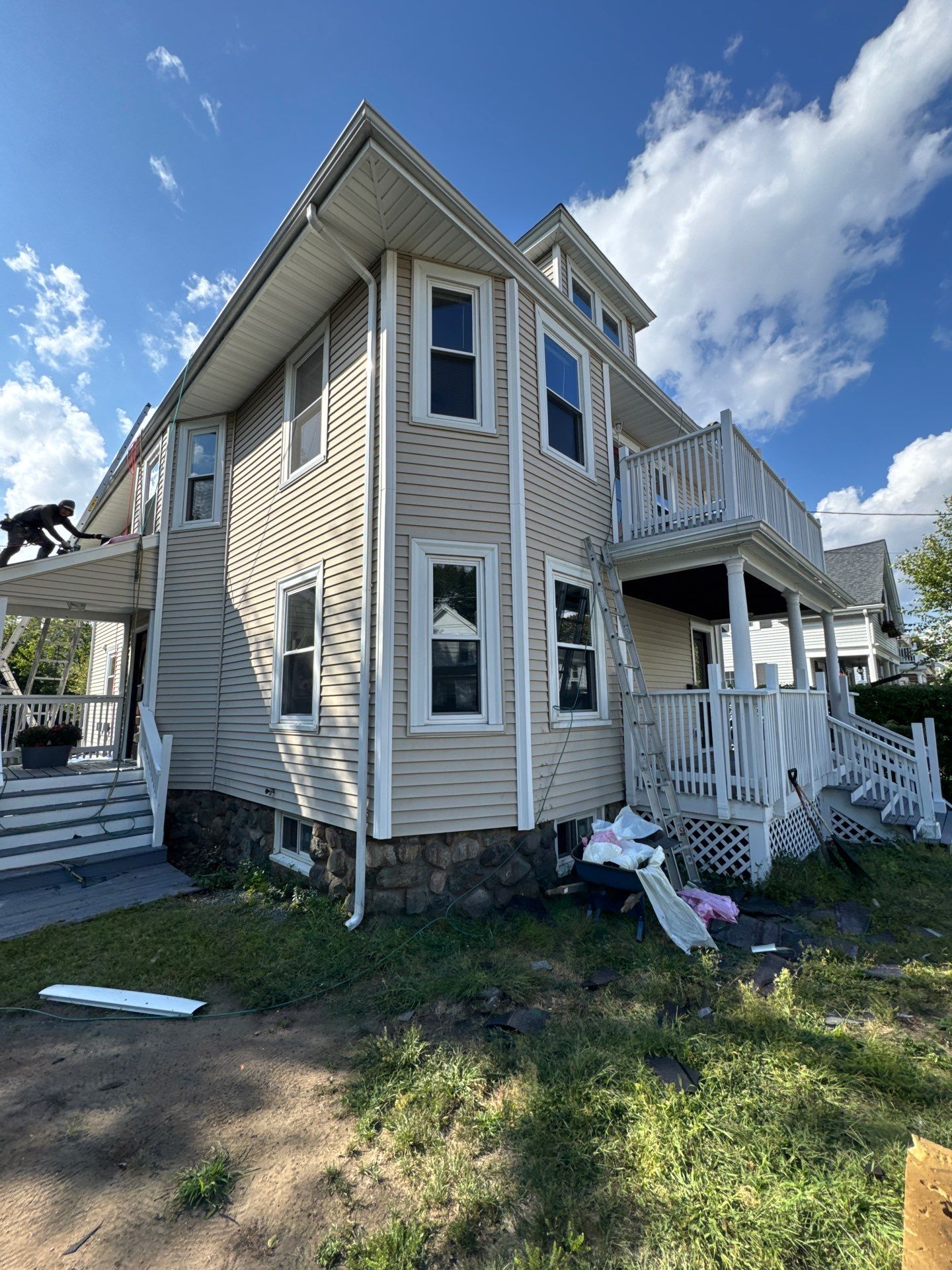 Roof Replacement with Skylight Flashing in Waltham, MA by Mighty Dog Roofing of Greater Middlesex County