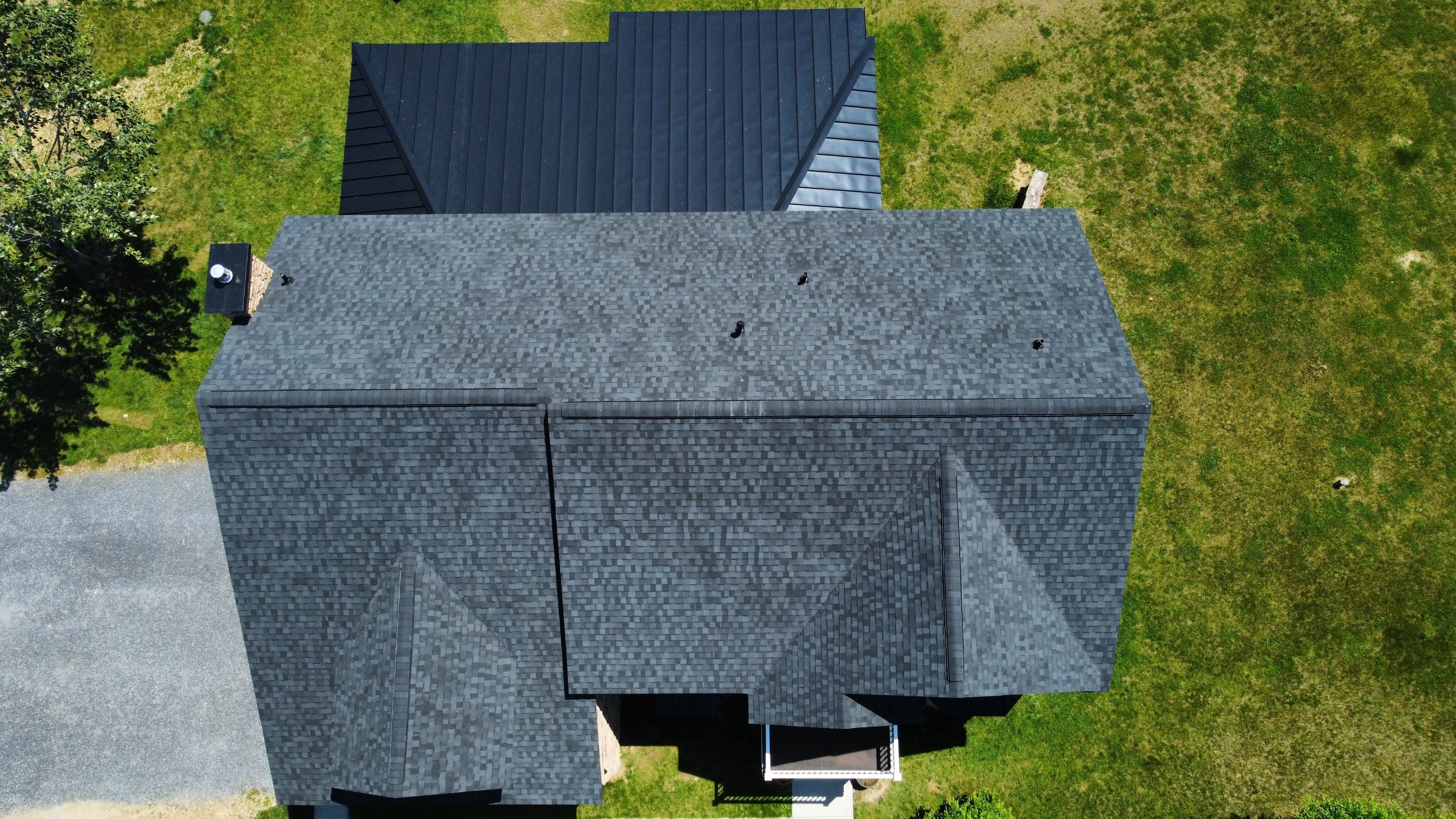 Roof Damage using Certainteed Lifetime Roofing System- Moire Black Landmark Pro shingkes with shadow ridge caps. by BulletpROOF Exteriors