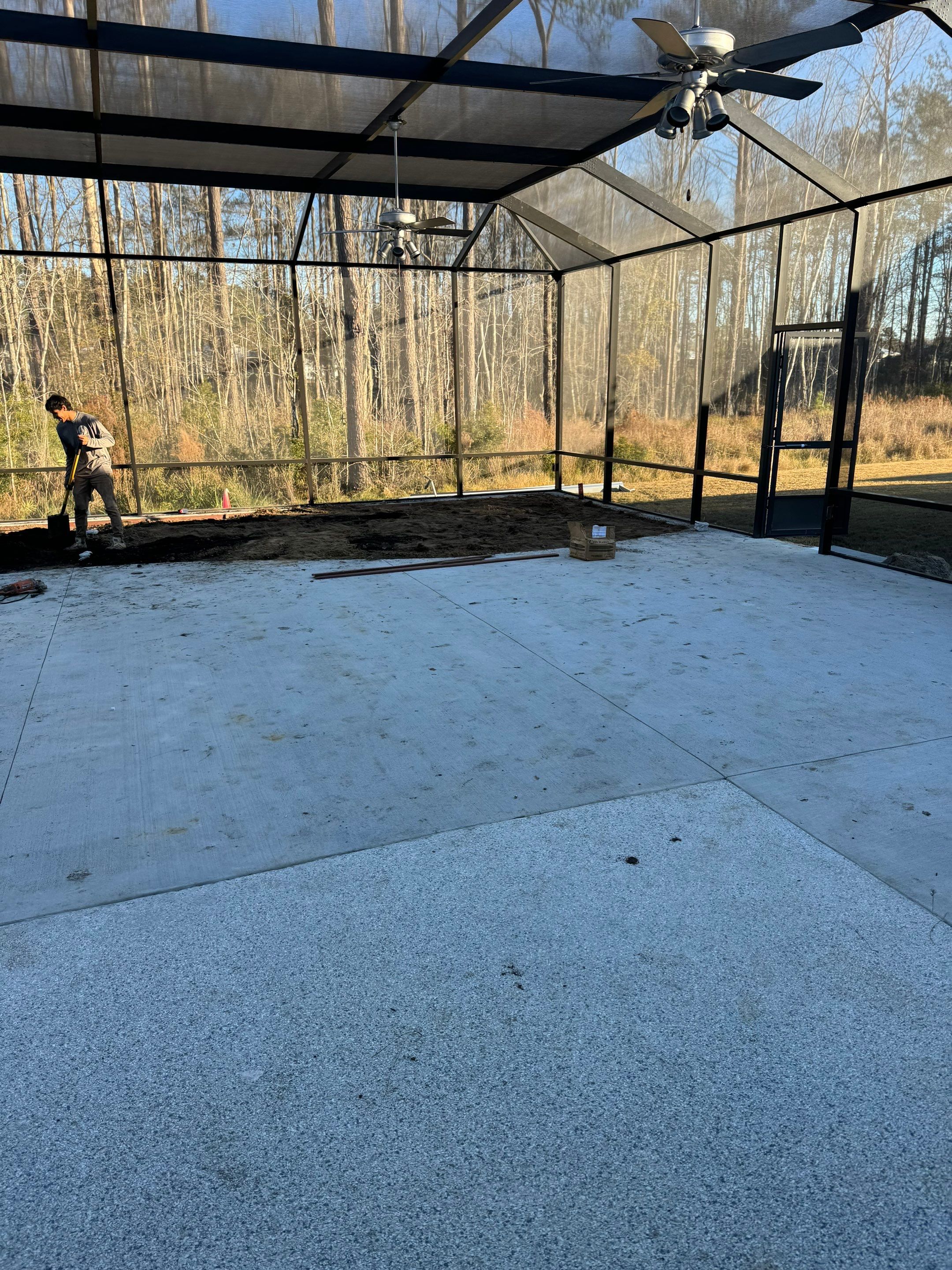 Hardeeville Screened-In Concrete Patio and Integrated Artificial Turf by Lowcountry Scapes, LLC