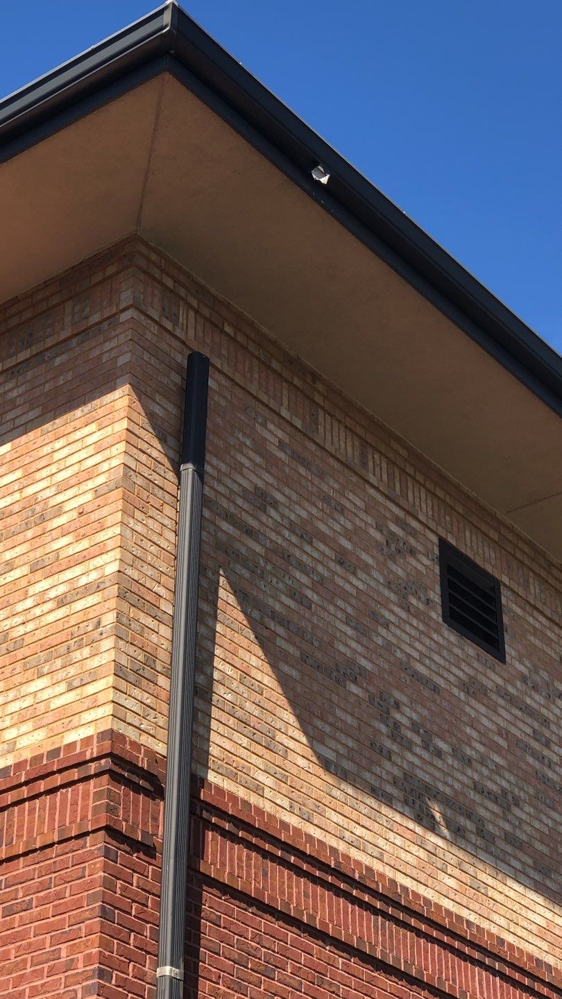 Pensacola Realtor Association Gutter Installation using K-Style White Gutters by Gutter Professors