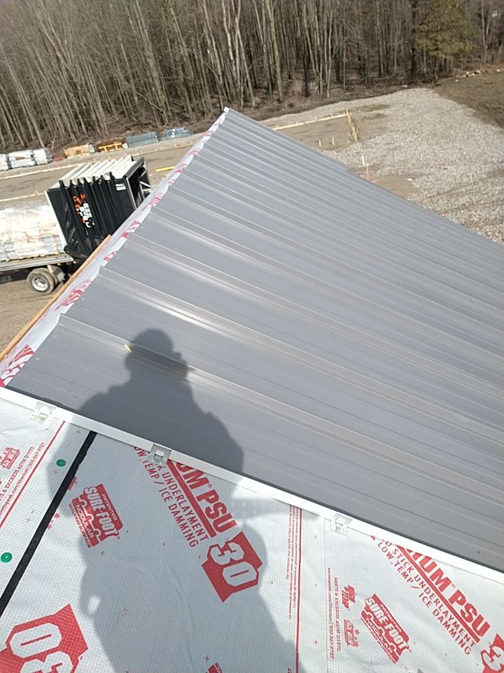 Commercial Roofing Installation using Metal roof  by Absolute Roofing and Construction