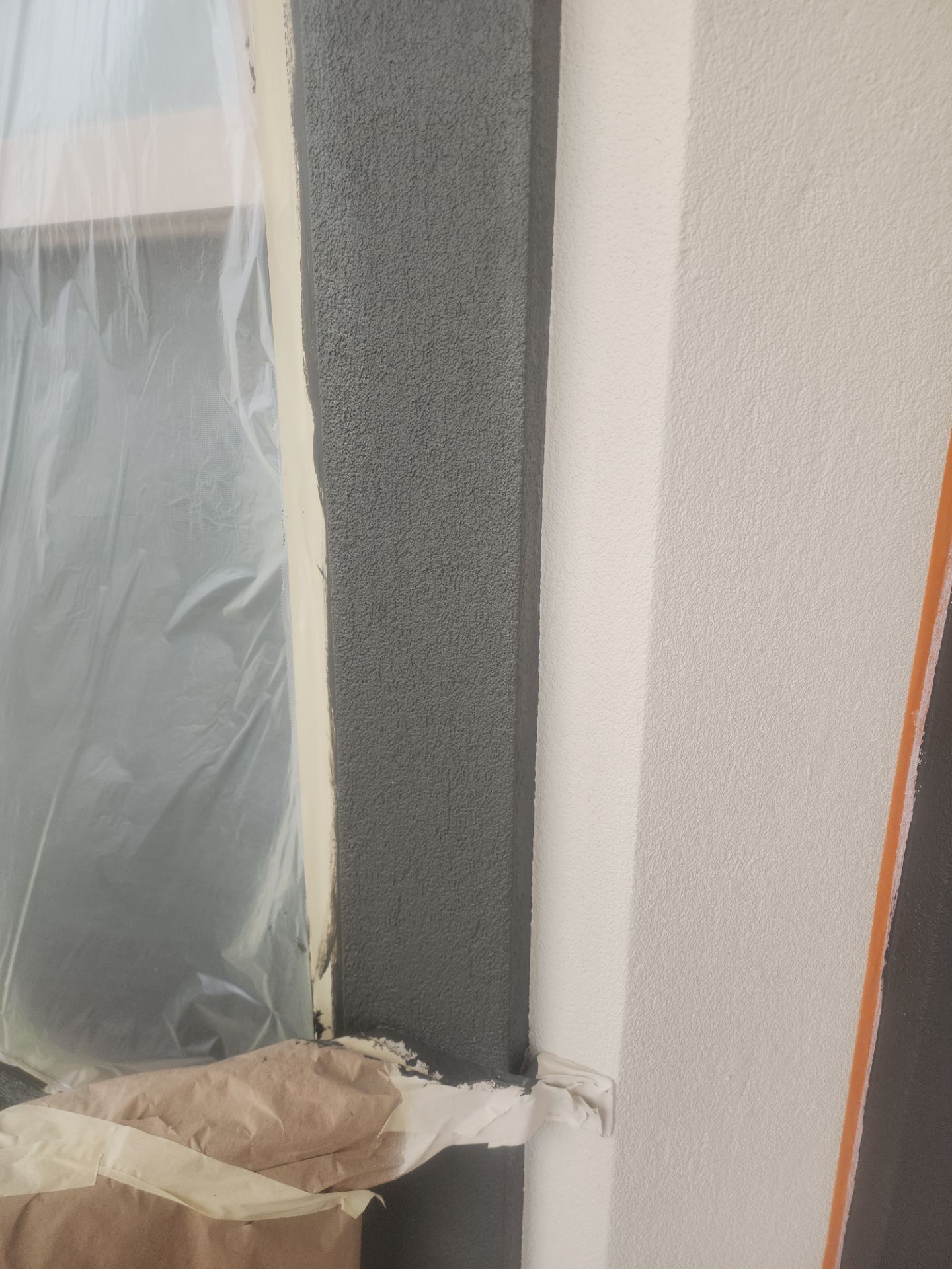 Castle Rock Elegance: White Stucco Exterior with Bold Tricorn Black by J&M Painting LLC