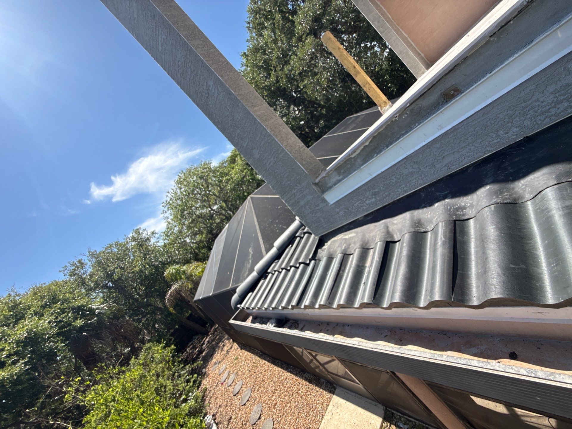 Flagler Beach Residential Tile Roof Replacement with Dark Barrel Tiles by Fortified Roofing Solutions Corp.