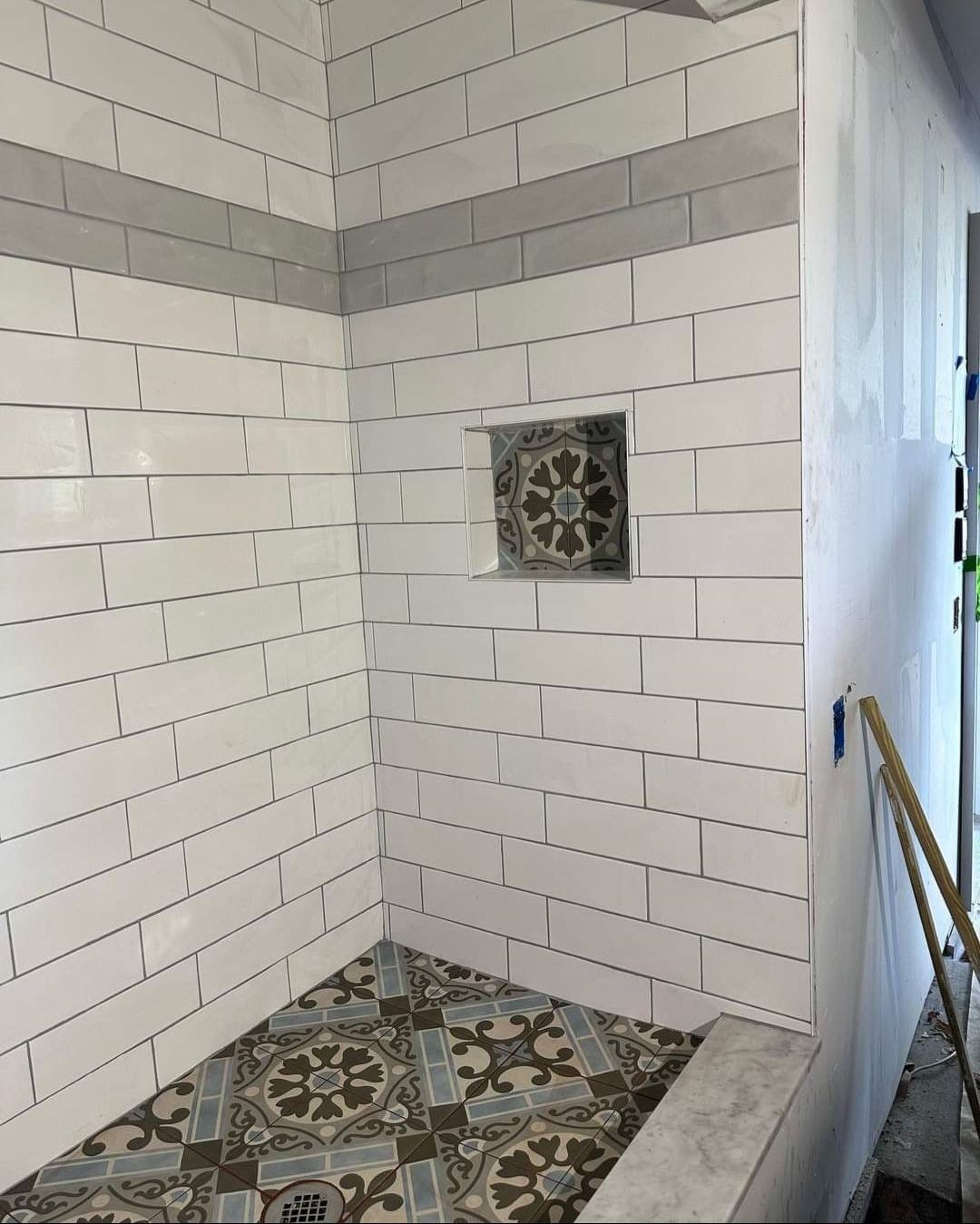 Jack & Jill Bathroom Floor + Dog Washing Nook with Niche using Porceline Subway Tile by Footprints Floors Morristown
