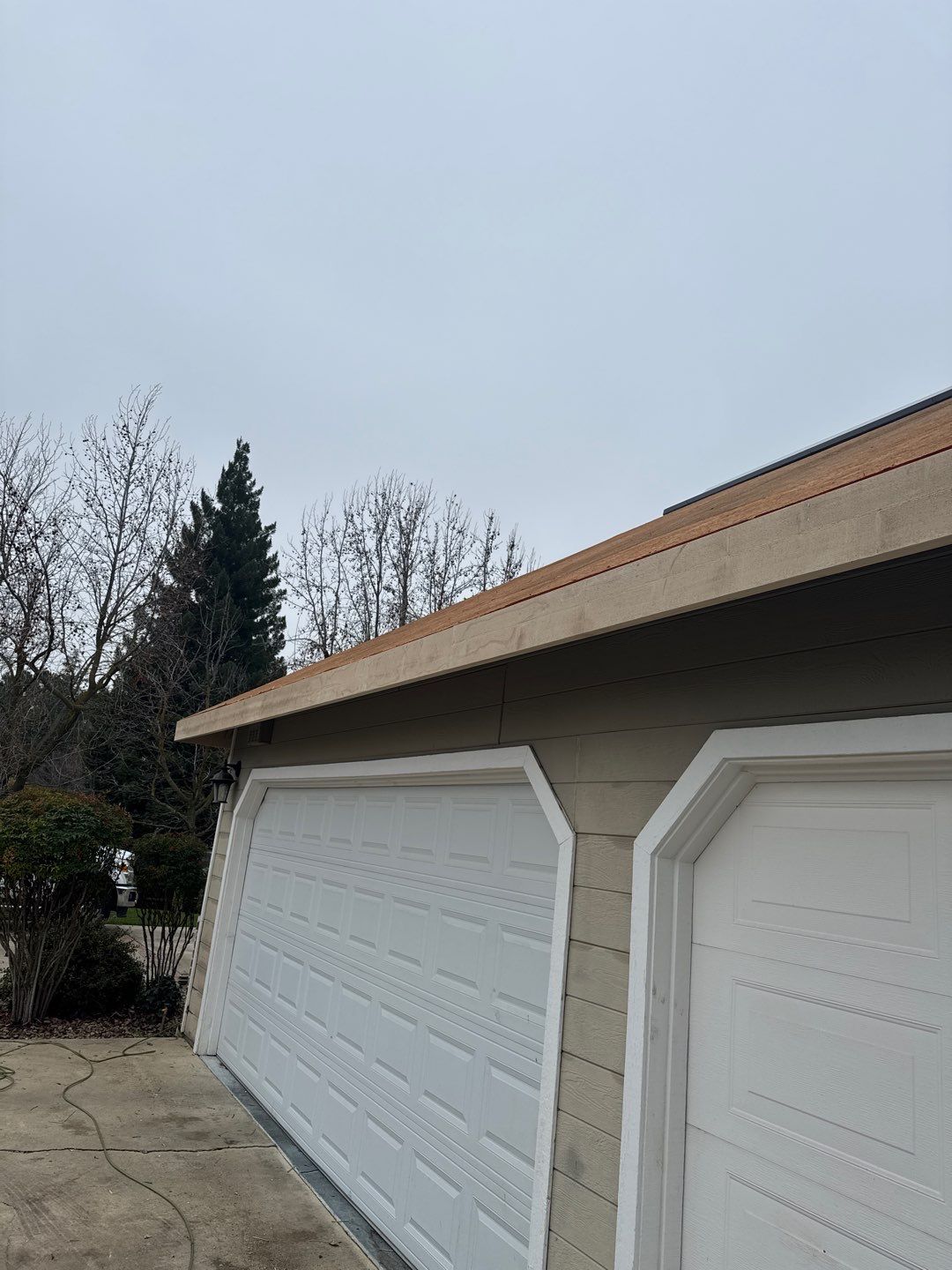 New shingles and gutters using GAF Timberline HDZ shingles and aluminum gutter by Straight Edge Roofing Inc