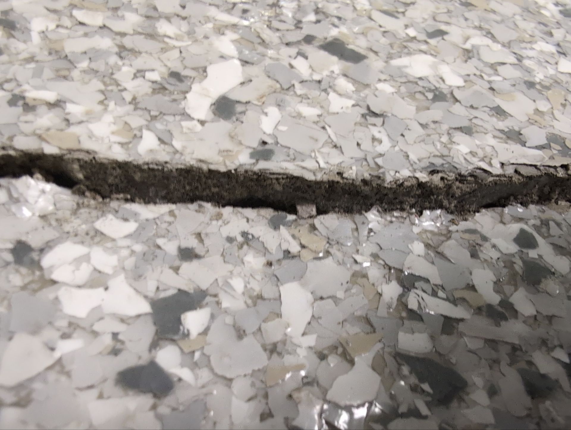 Medina Cracked basement floor with Epoxy by Beck Restoration Management Group