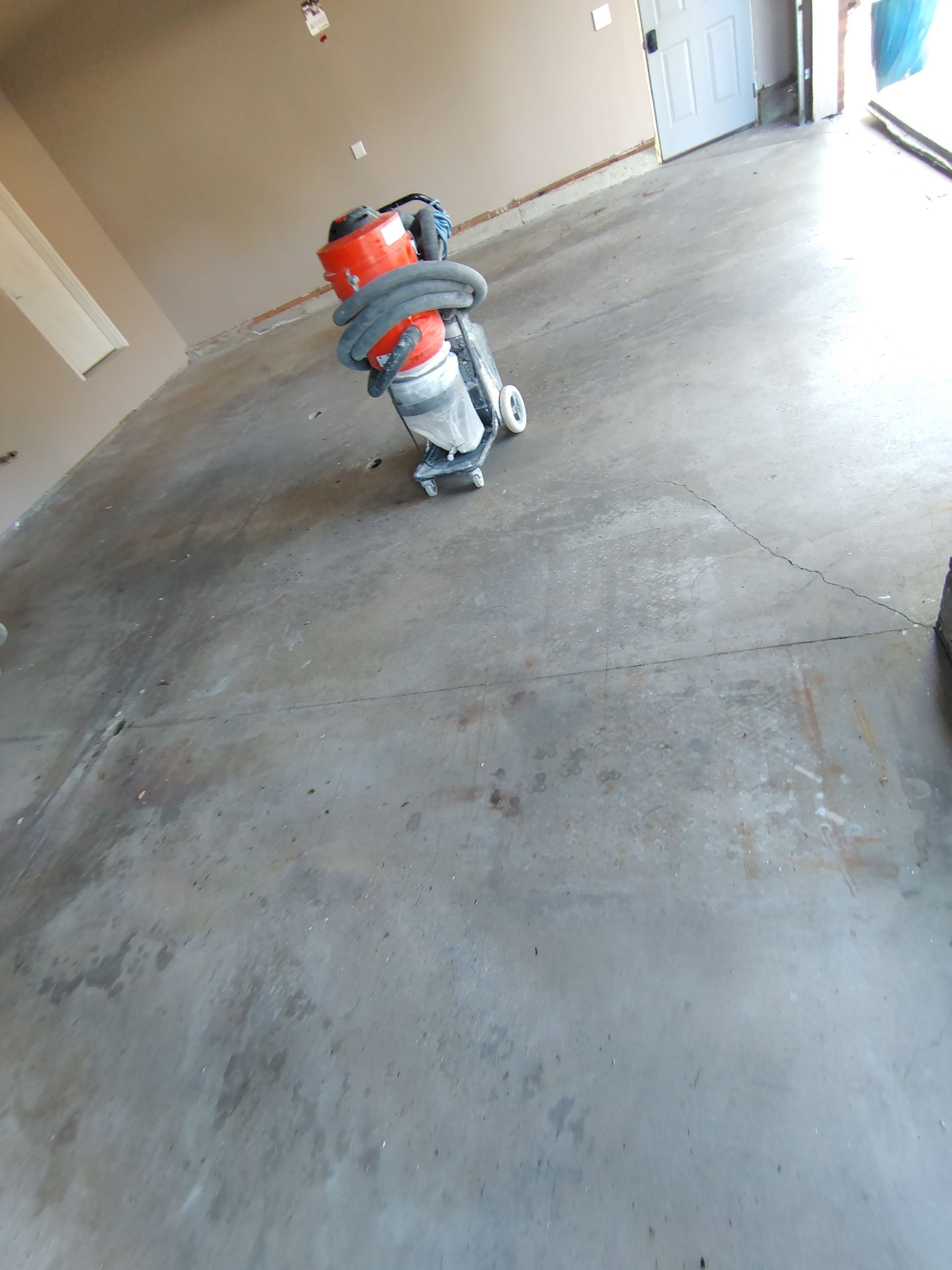 Sioux Falls Garage Concrete Repair and Epoxy Flake Floor Coating by Select Painting, Coatings & Garage Cabinets