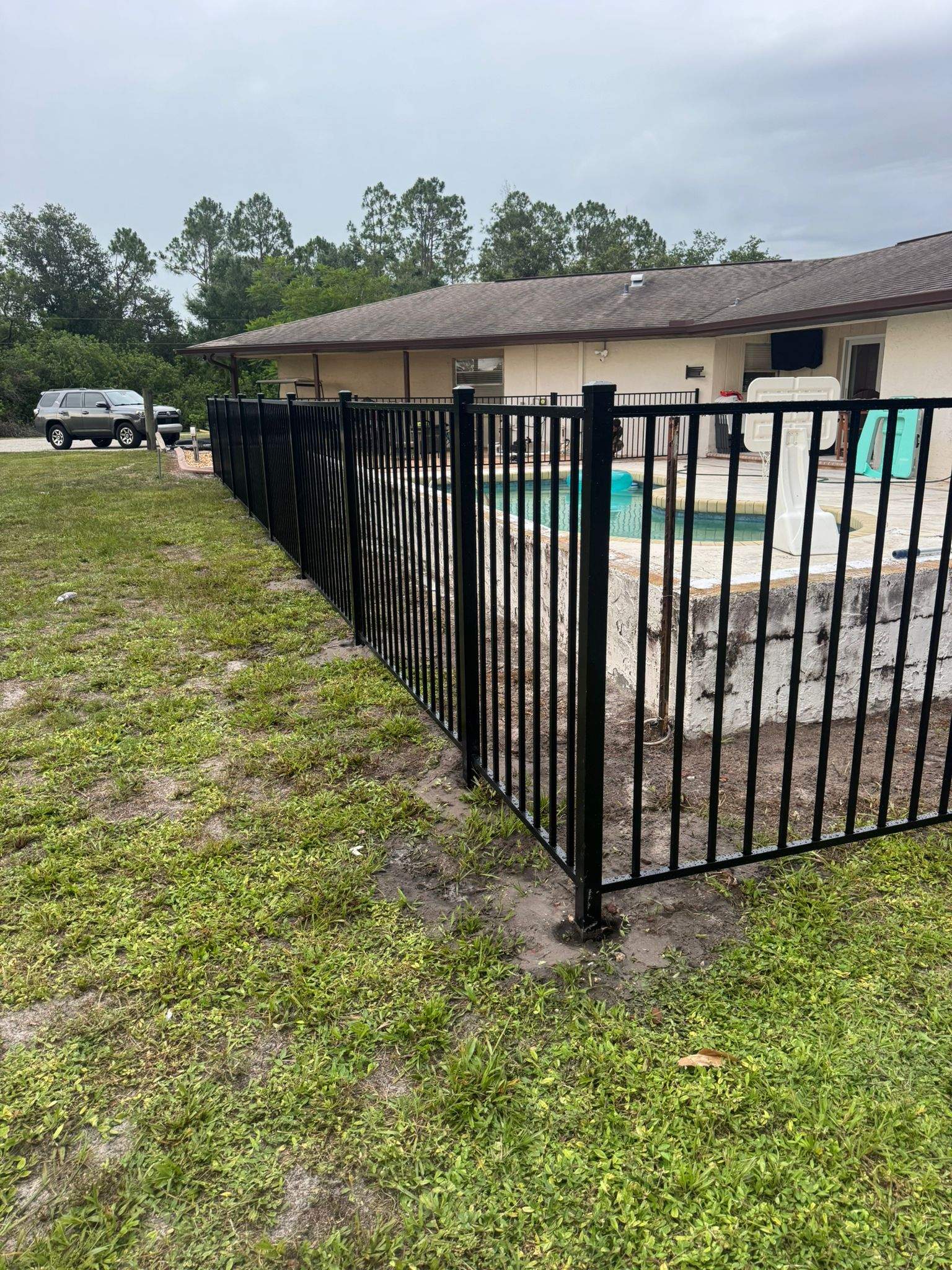 Black Aluminum Pool Safety Fence Installation in Punta Gorda by True Fence LLC