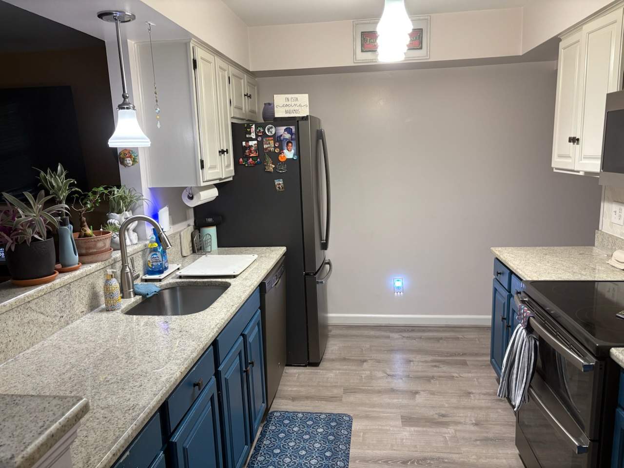 Two-Tone Kitchen Cabinet Refinishing and Granite Countertop Installation by Top Shelf Painter