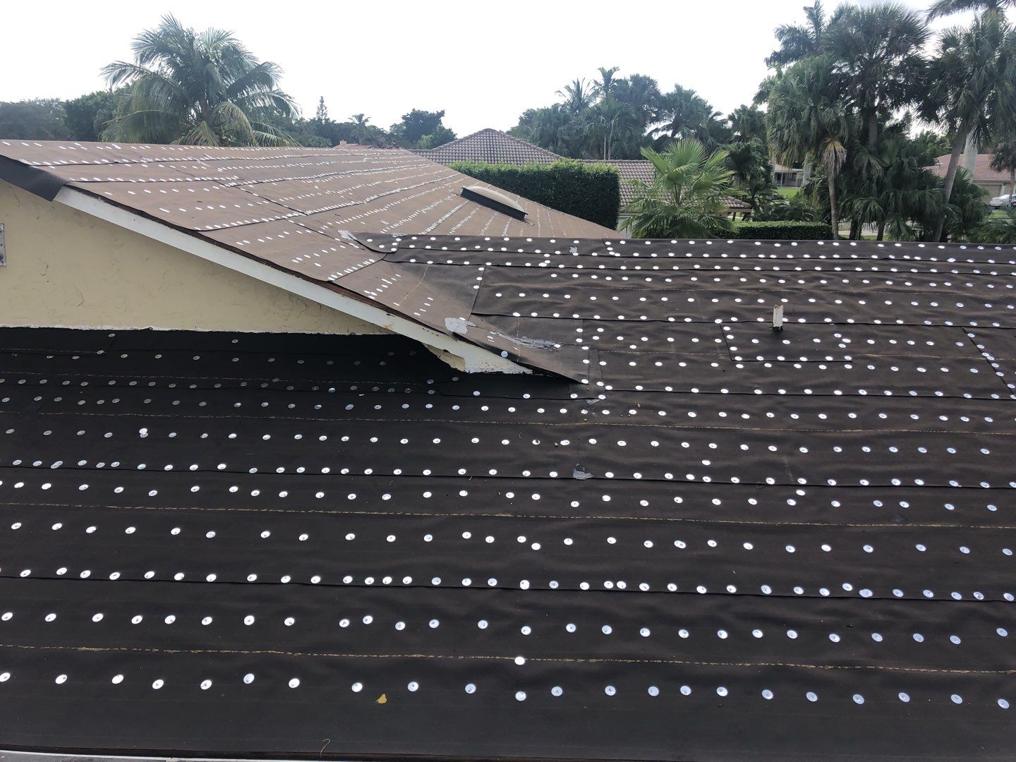 Residential Roofing Installation using 1" Nail strip metal roof by BLUES BROTHERS ROOFING
