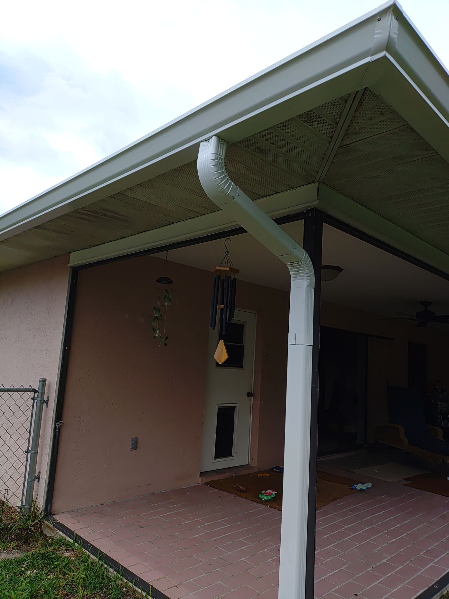 Replace gutter using White Down Spouts in Cape Coral FL by Gutter Professors