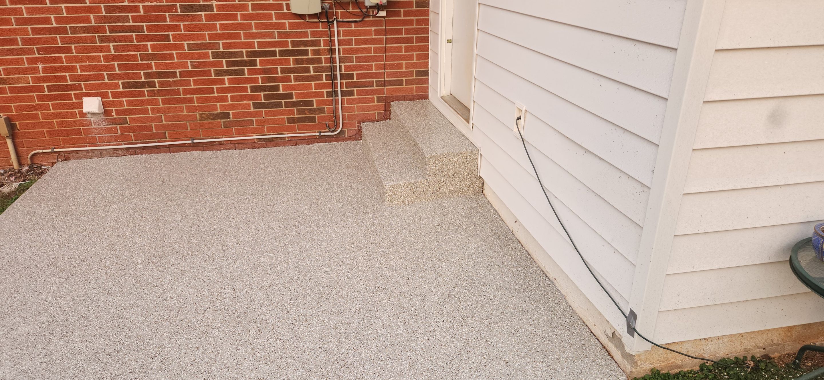 Back Patio using Creekbed by Elite Floor Solutions
