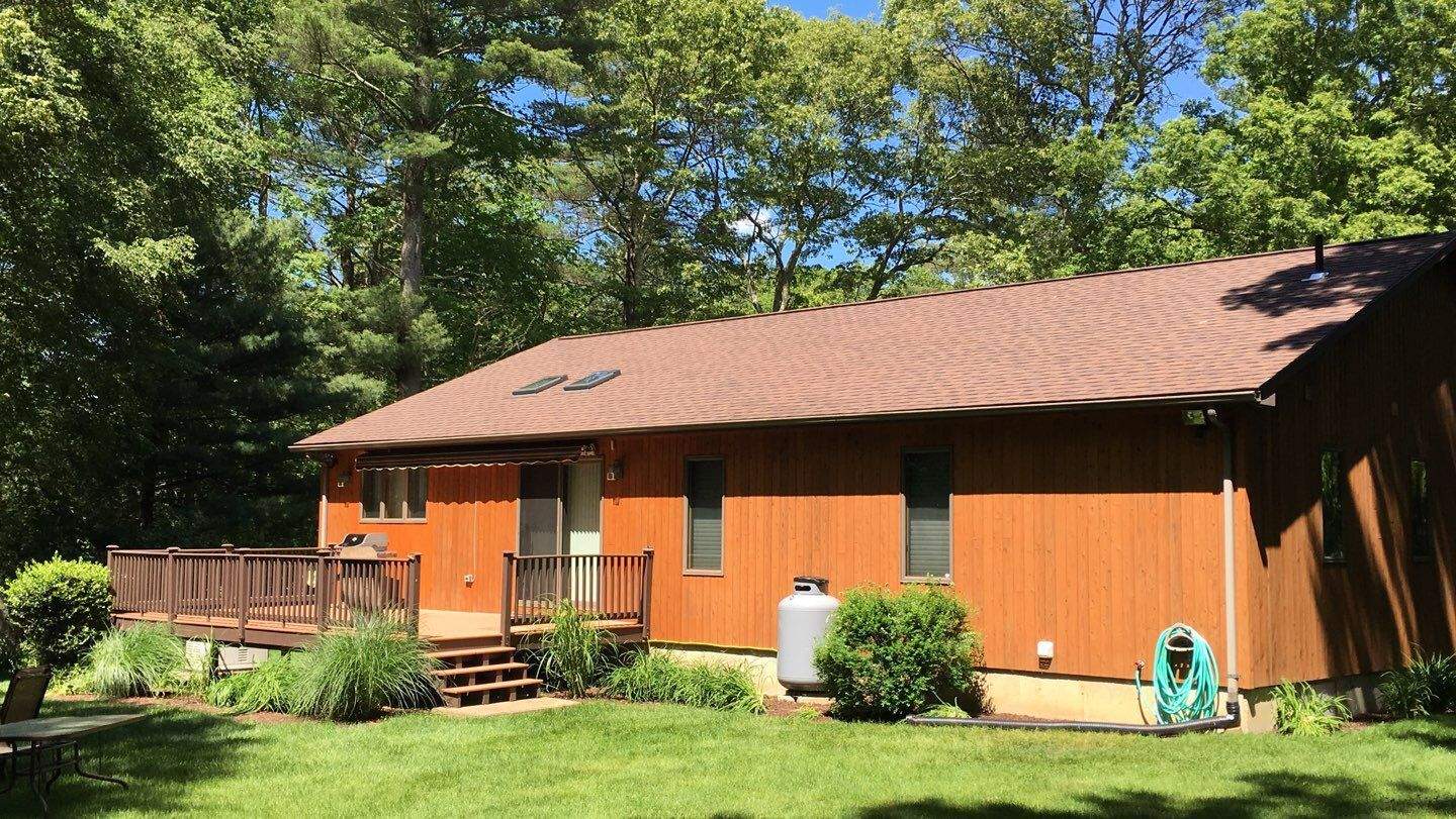 Burnt Sienna Roofs by Pinnacle Roofing & Skylights