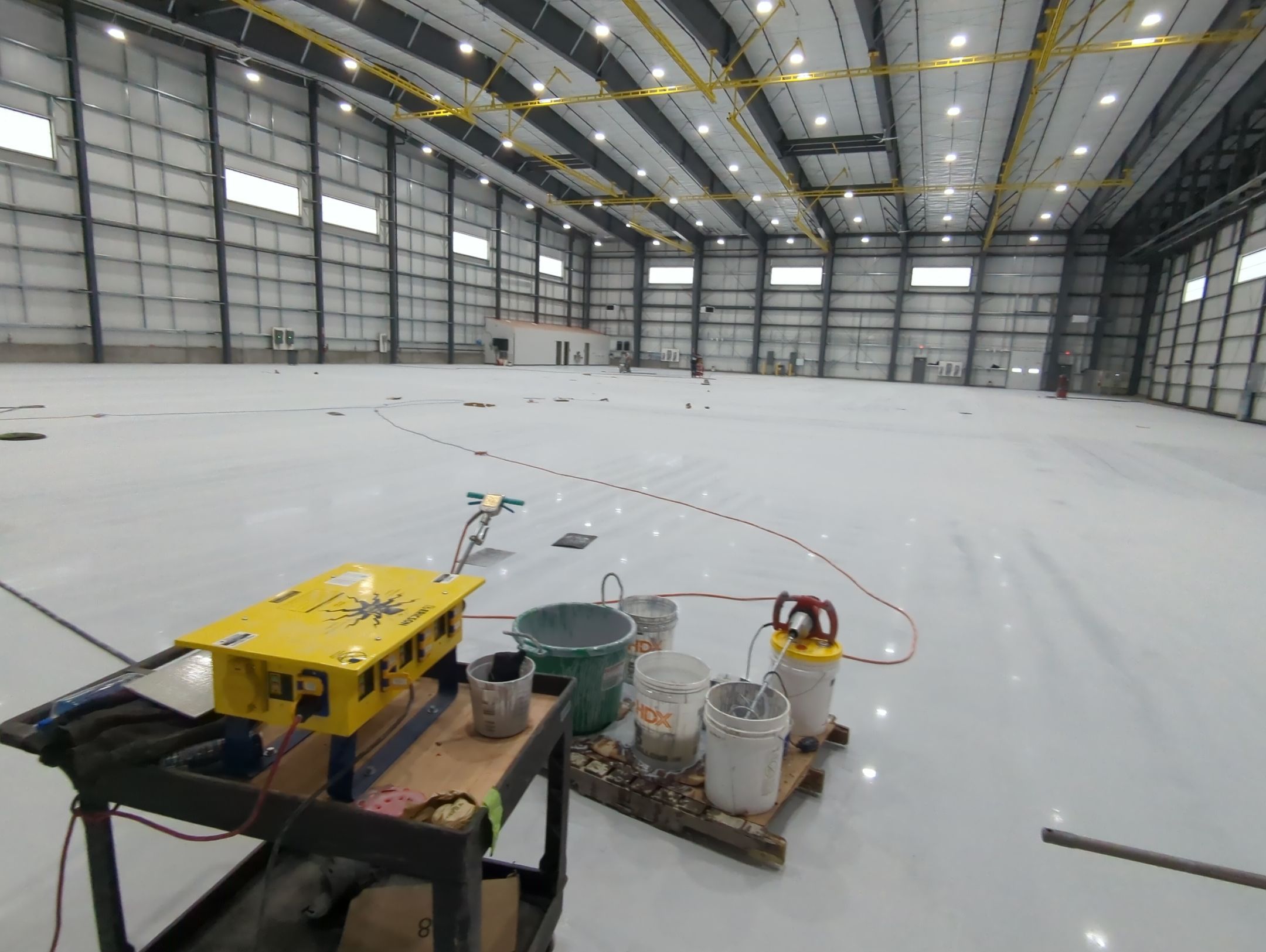 Airplane Hanger using Light Grey Commercial Penntek Epoxy by Croc Coatings, LLC
