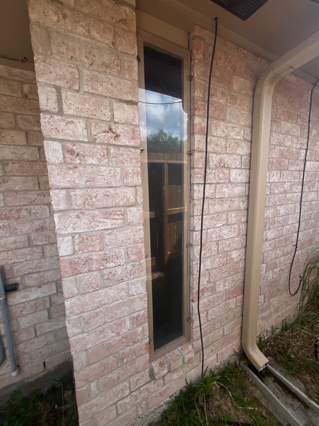 Colored Vinyl Windows to blend into brick by Bayfront Roofing and Construction
