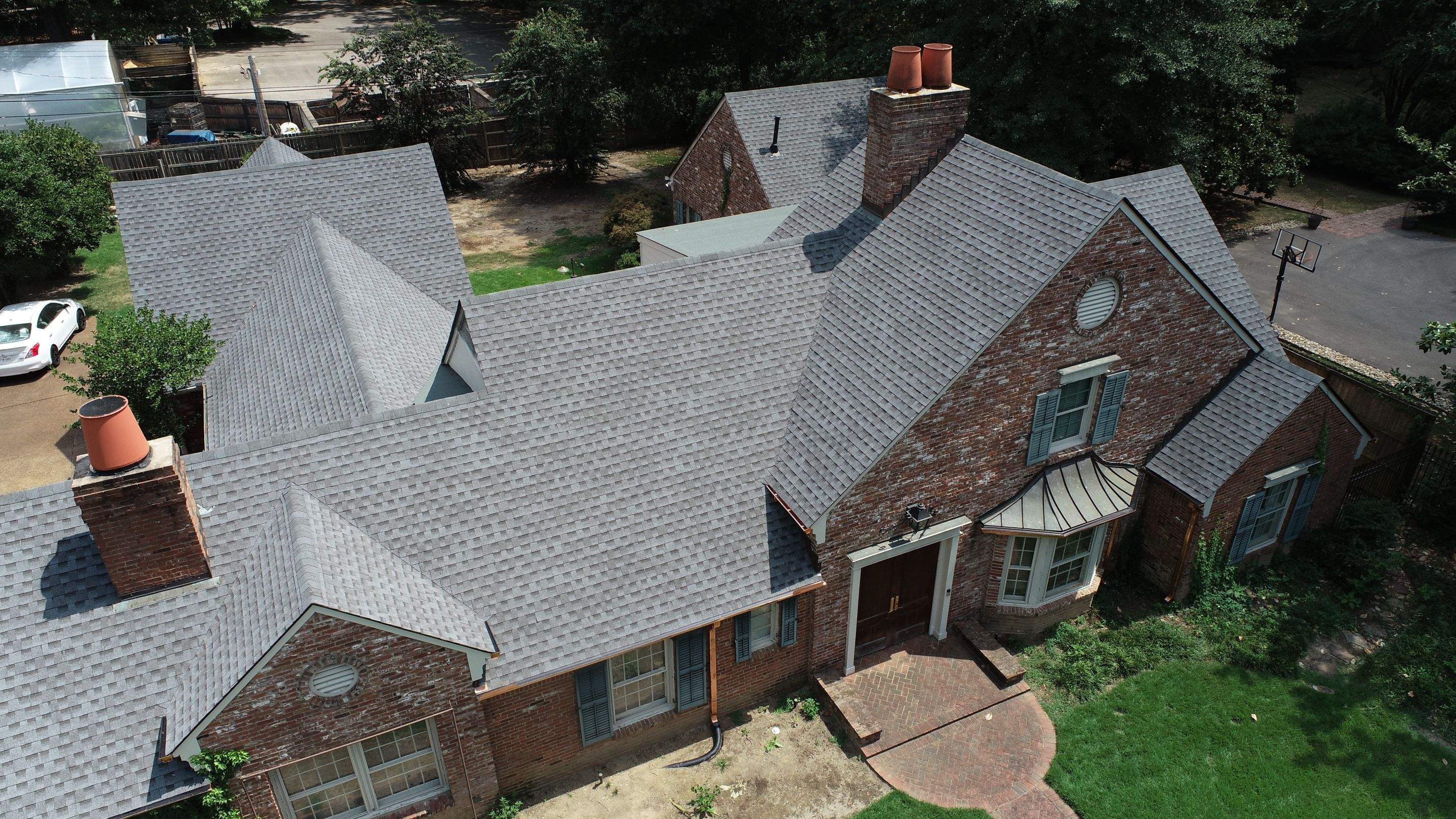 Full Roof Replacement with gutter upgrade after tree impact damage in East Memphis by Revival Roofing Services