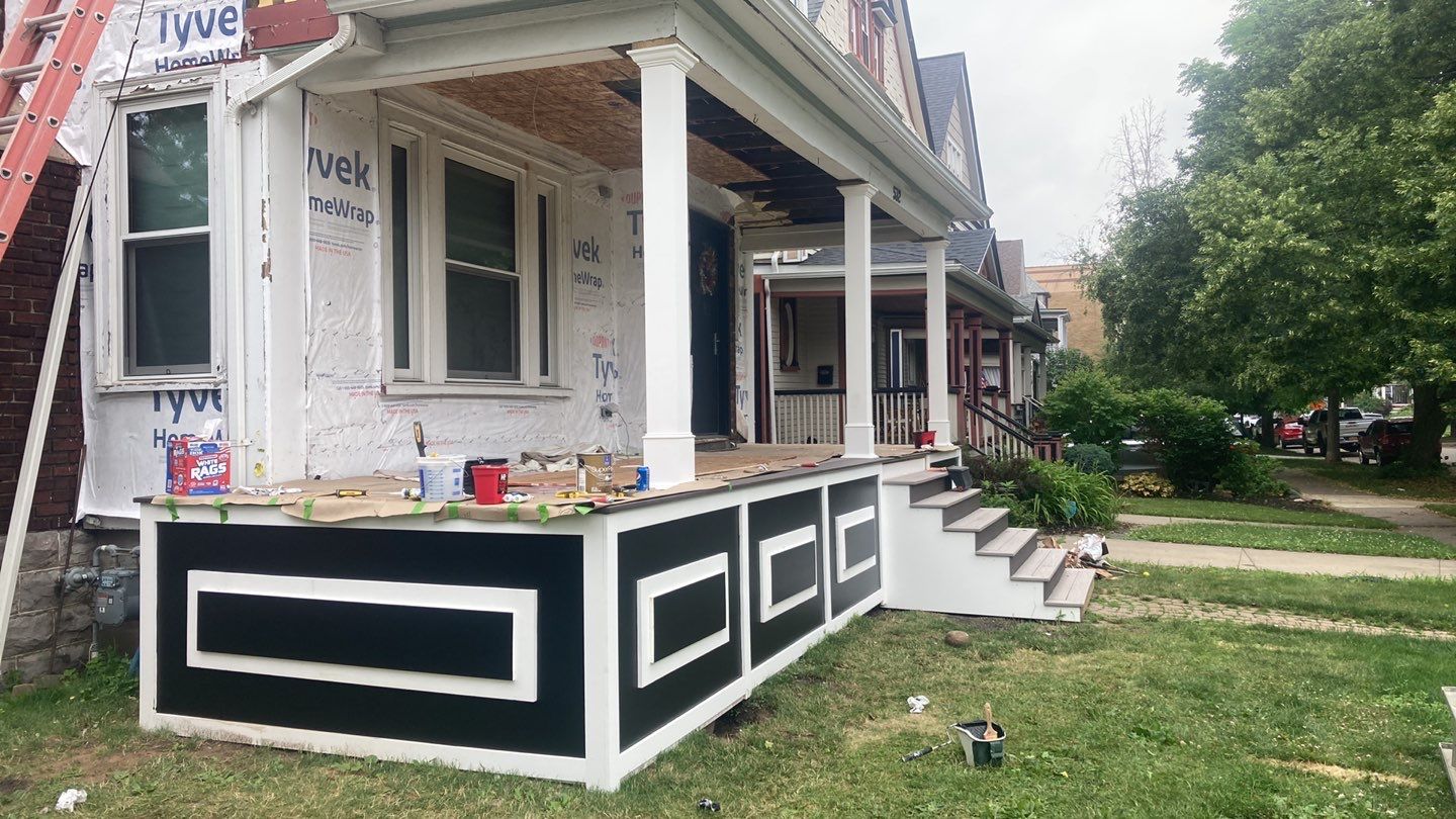 Exterior Renovations- Siding, Stamped Concrete, Porch, and Railings by Ivy Lea Construction