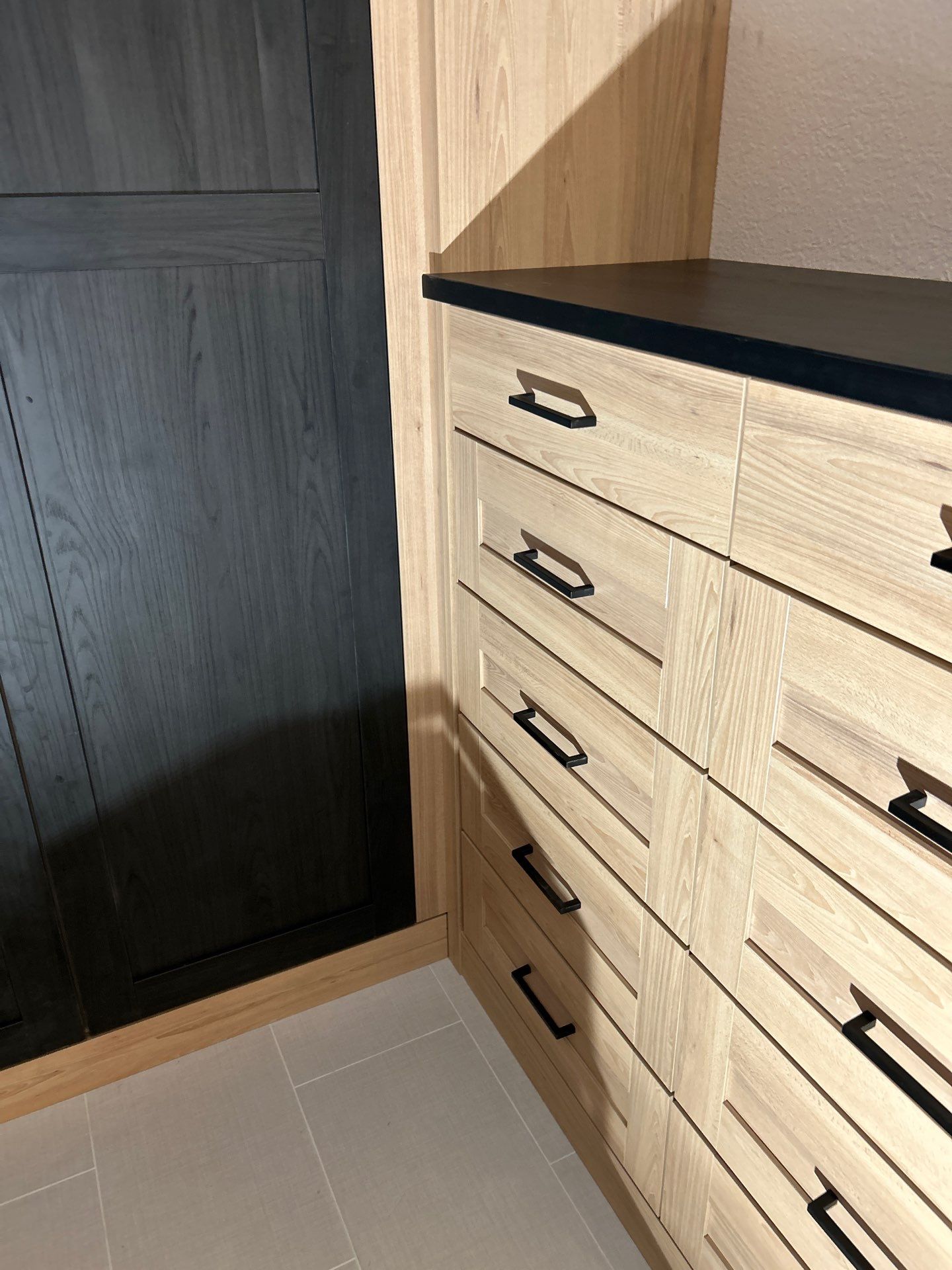 Two-Tone Closet with matching Mudroom + Laundry Room by Concept 32, Inc.
