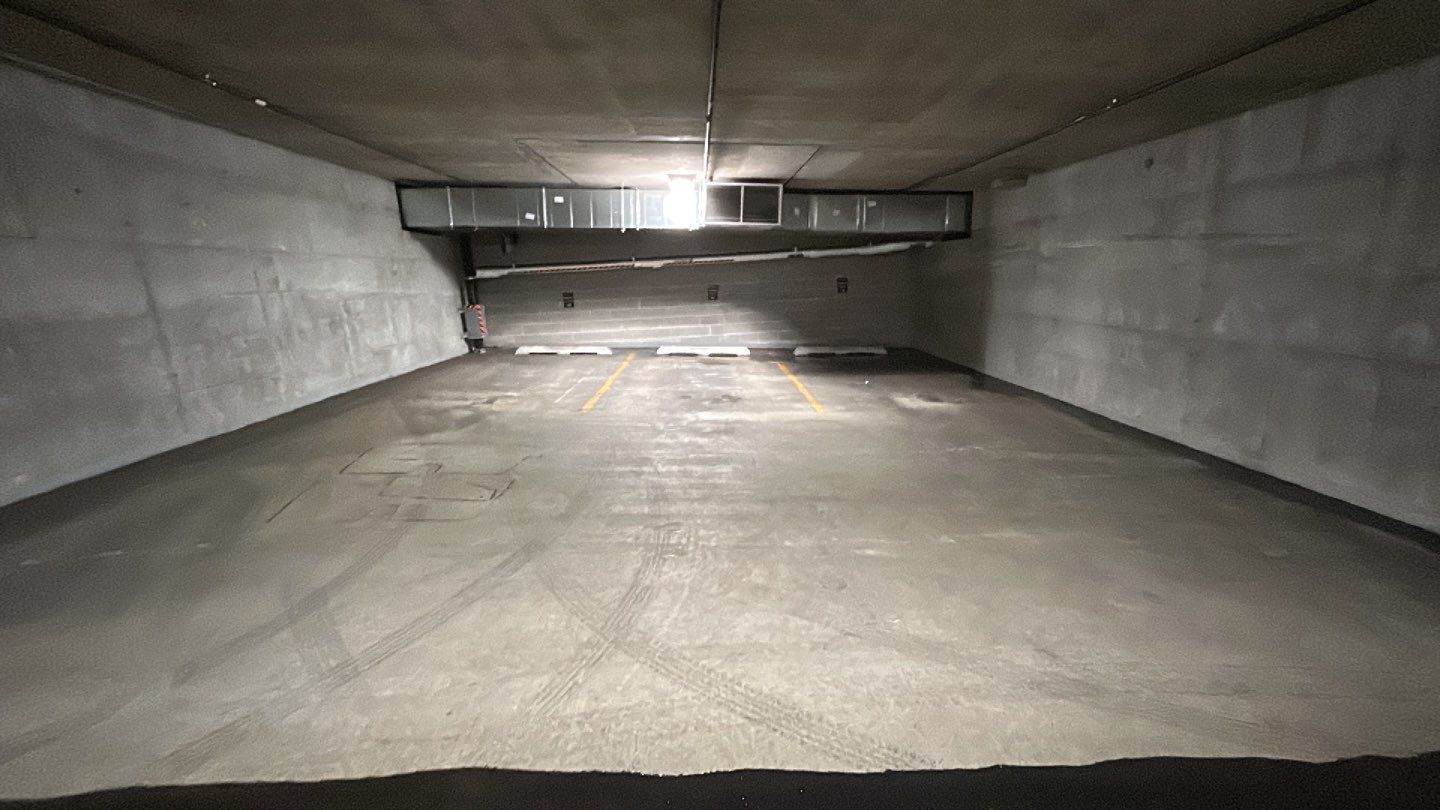 Parking garage using Hot water by Northern Power Washing LLC.