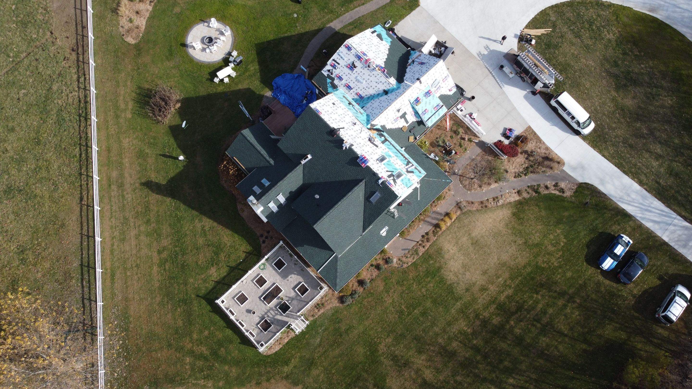 Residential Roofing Replacement with Multiple Skylights in Mason, Michigan by Acme Exteriors