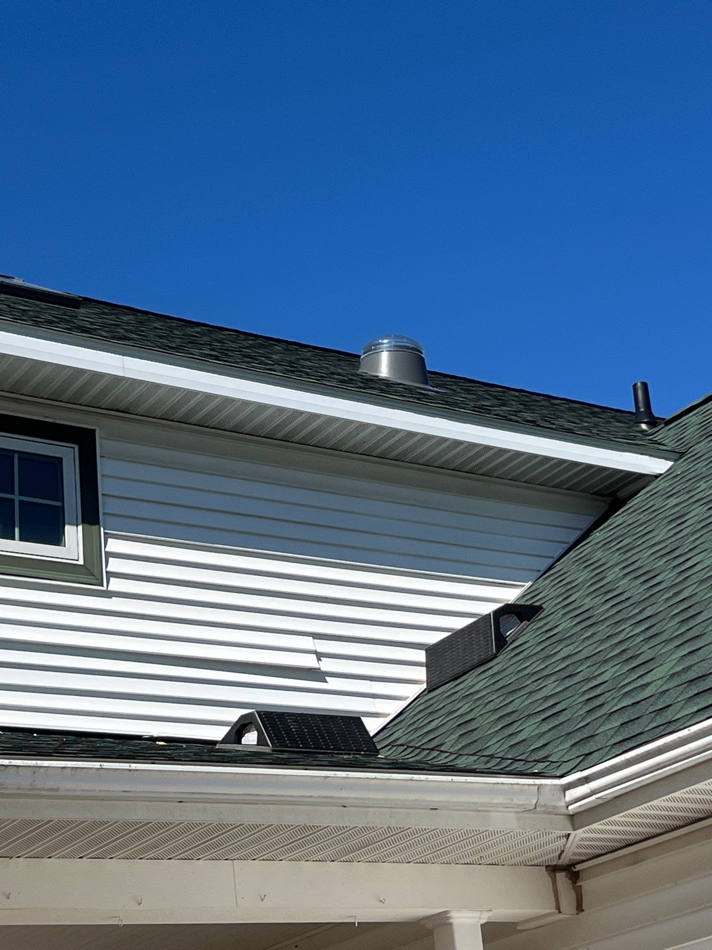 Residential Roofing Replacement with Multiple Skylights in Mason, Michigan by Acme Exteriors