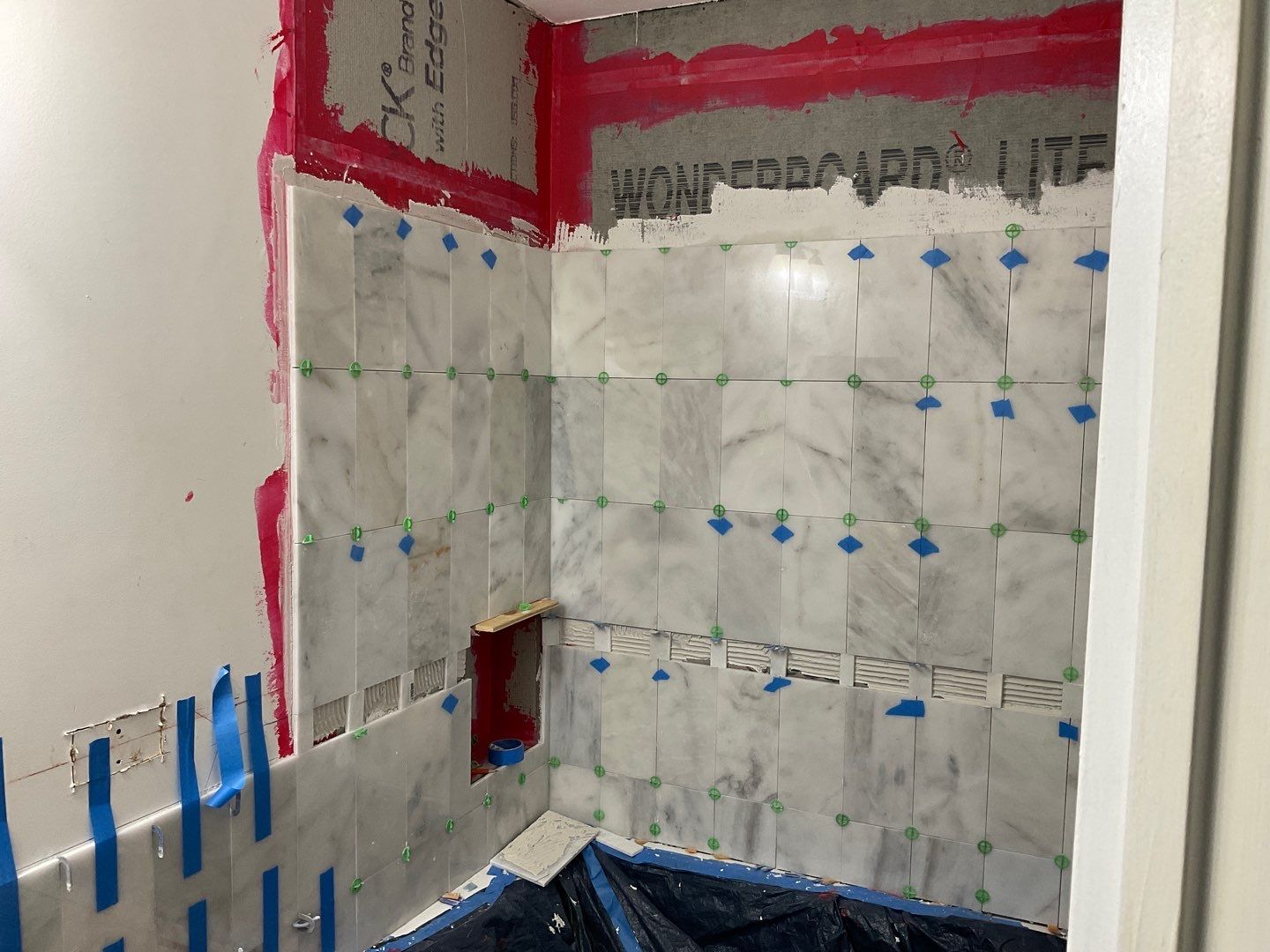Bathroom Remodel using Two new bathroom design and new floors by Alpha Design Services