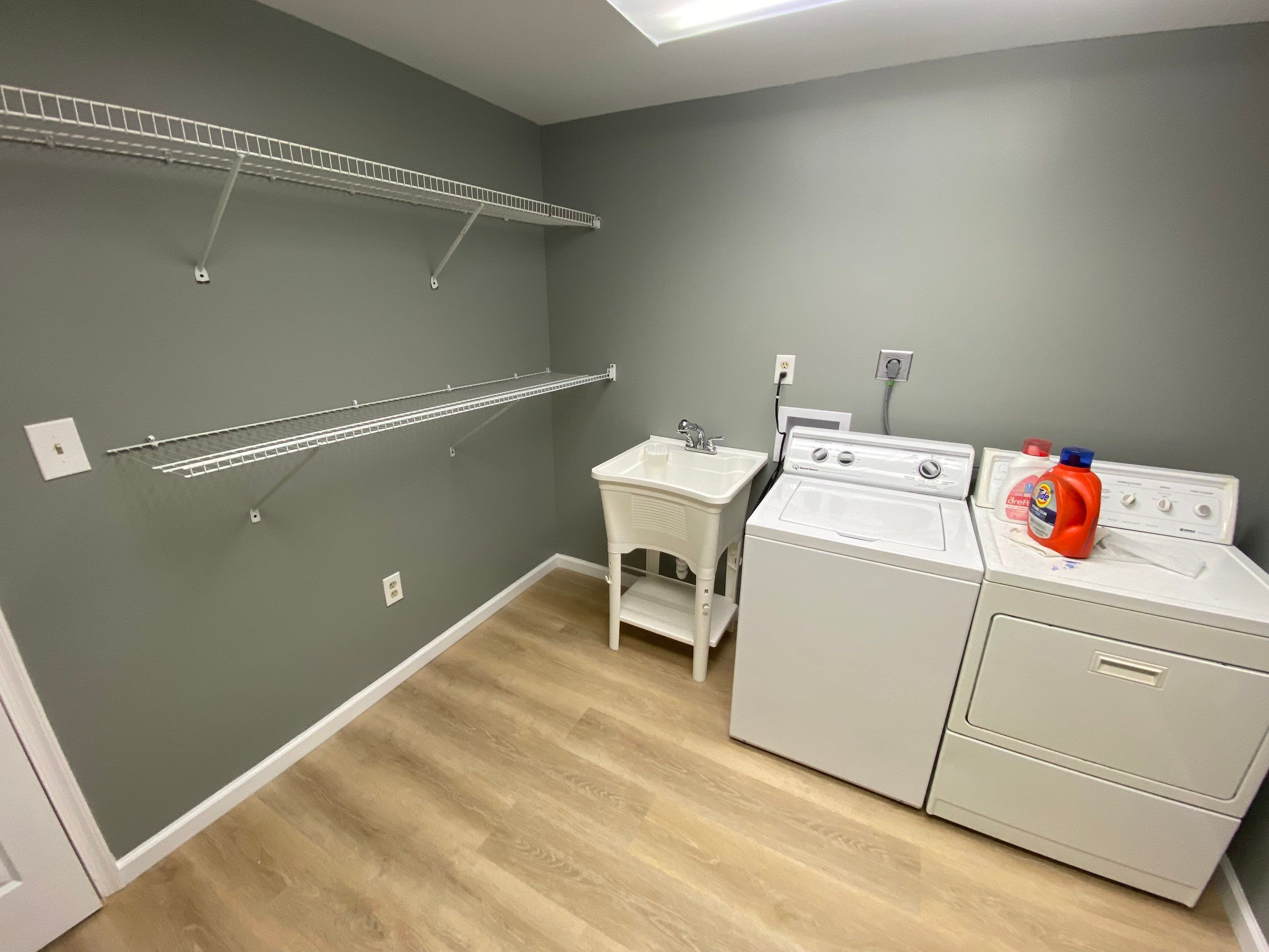 Laundry Room Redmodel using Lifeproof Luxury Vinyl Plank Flooring by The Smet Companies, LLC