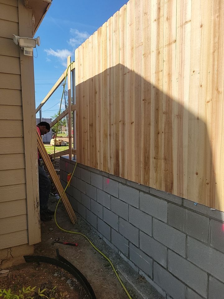 Cedar Fence using Cedar Pickets and Metal Poles by Clays Services Inc
