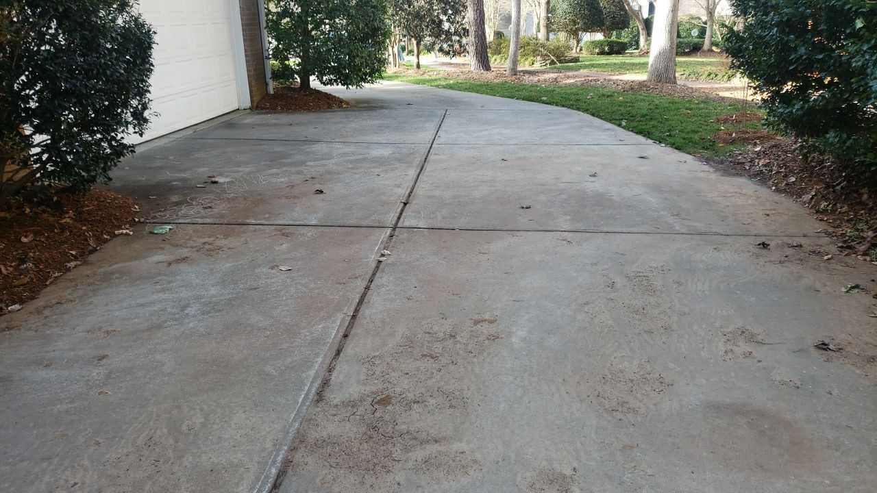 Driveway Clean using cleaner by Power Wash Masters LLC