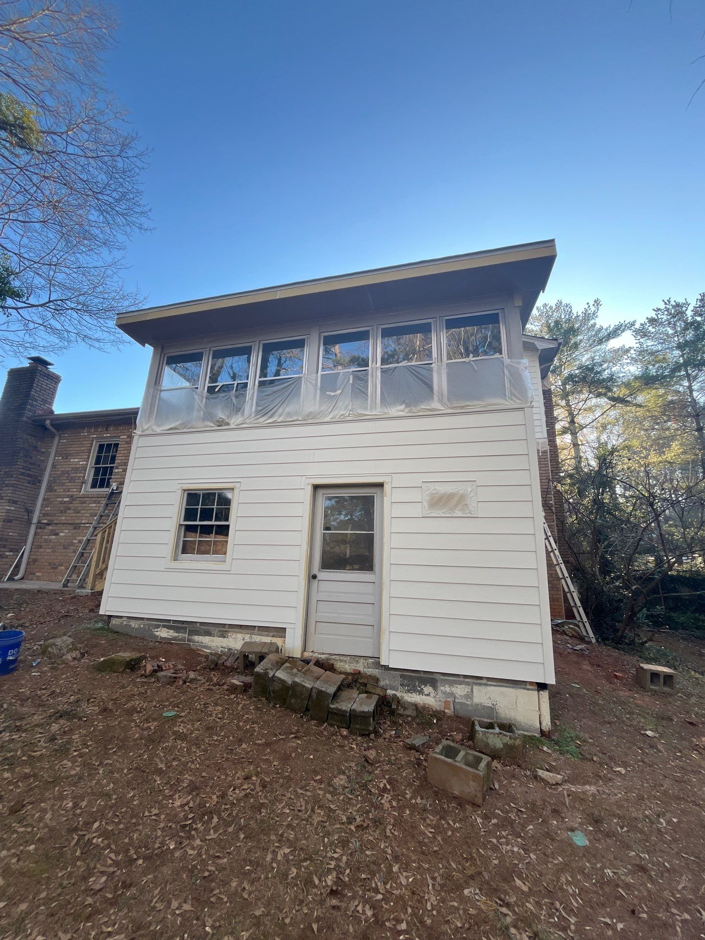 Board and Batten Siding Installation and Railing Replacement in Lilburn, GA by Nelson Exteriors 