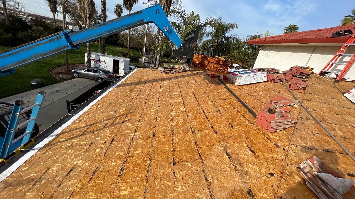 Tile refurbish project using existing tiles and replaced underlayment and battens by Straight Edge Roofing Inc