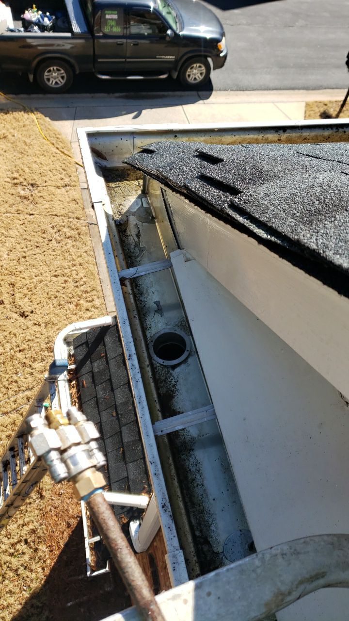 Gutter Cleaning using water by Power Wash Masters LLC
