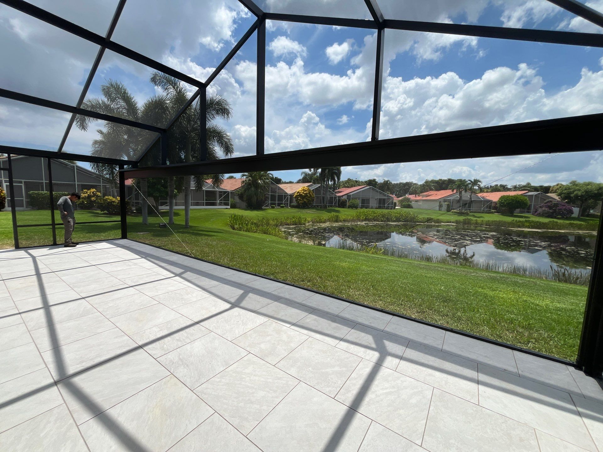 Porcelain Paver Patio and Screen Enclosure Installation in Boynton Beach by The Screen Depot, Inc
