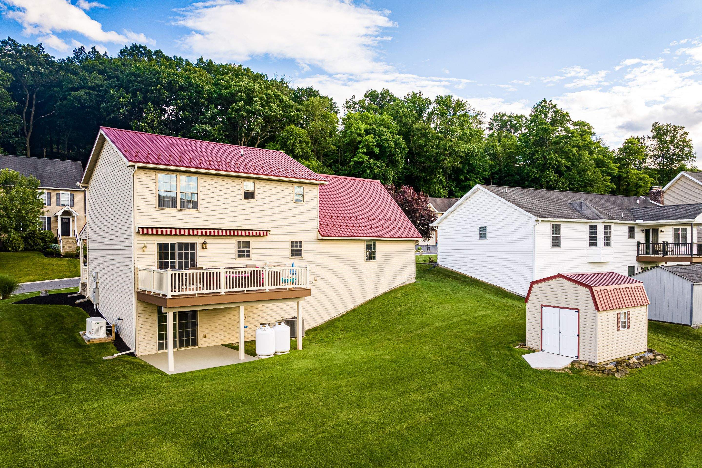 Metal roof-colonial red by Esh Builders