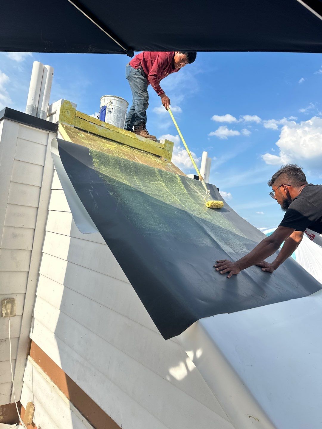 TPO Roofing System with Roof Deck Pavers by Undersun Roofing 